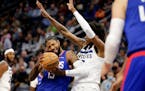 Los Angeles Clippers guard Paul George (13) drives on Minnesota Timberwolves forward Jaden McDaniels, right, during the first half of an NBA basketbal