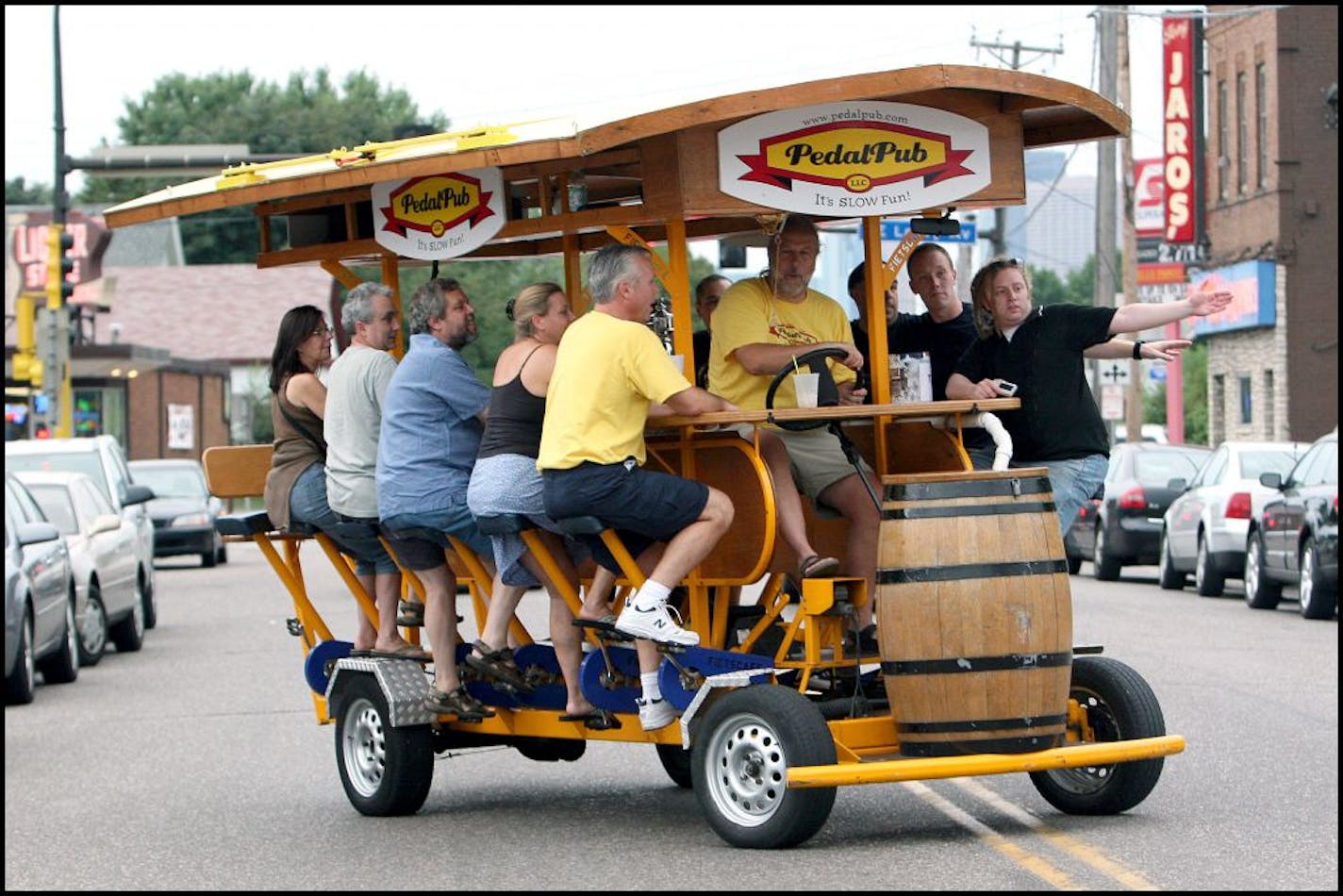 TOM WALLACE � twallace@startribune ASSIGN#112460_SLUG_night0831.#112460_8/9/2007 Al Boyce, and Eric Olson on the left, managing partners, of the Pedal Pub take the right. This Pedal Pub tour made its way through the Northeast neighborhood route Wednesday around NE, visiting various bars. They start at the 1029 Bar, departing at 6 p.m. ____The Pedal Pub, creation that is basically a 16-person bar on wheels. The only one of it's kind in the country, customers jump on the Pedal Pub and pedal their