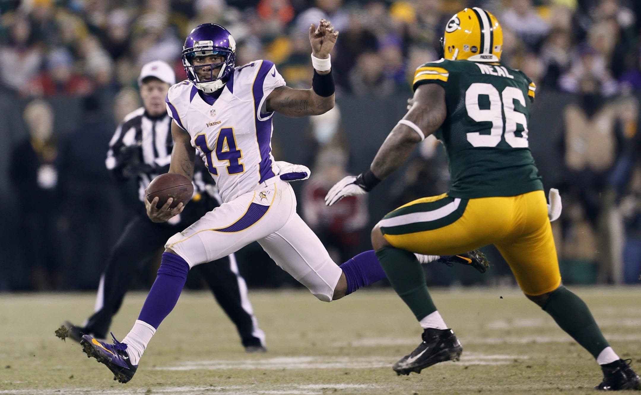 Joe Webb was flushed out of the pocket by Packers defensive tackle Mike Neal in the fourth quarter.