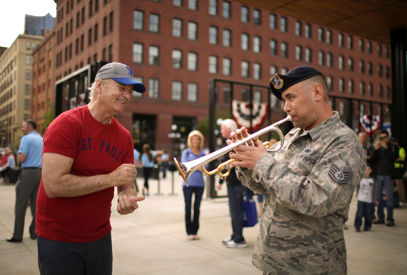 Saints minority owner Bill Murray applauded as Air Force Reservist Tech Sgt. Johnny Holliday as he finished up the last notes of "What a Wonderful World" before the St. Paul Saints home opener Thursday afternoon. ] JEFF WHEELER � jeff.wheeler@startribune.com The St. Paul Saints faced the Gary SouthShore Railcats in their home opener Thursday night, May 19, 2016, at CHS Field in St. Paul.