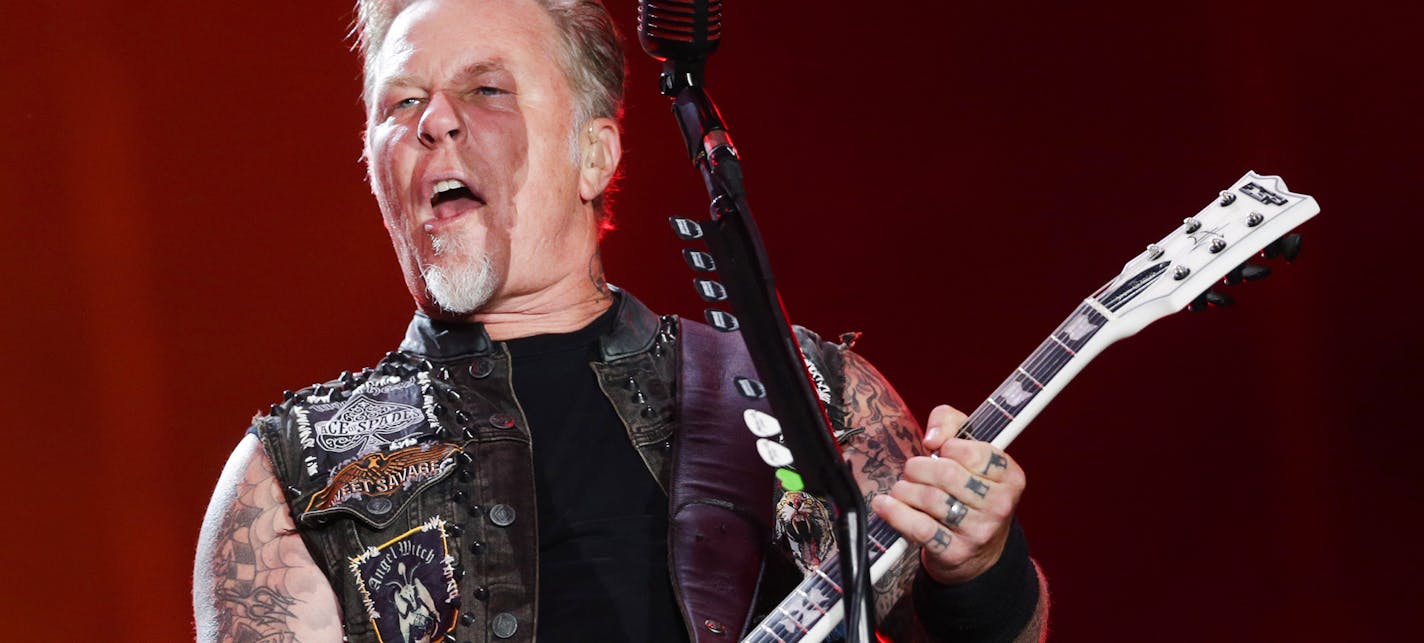 FILE - In this Sept. 20, 2015, file photo, James Hetfield of Metallica performs at the Rock in Rio music festival in Rio de Janeiro, Brazil. Metallica, Kendrick Lamar, Rihanna, Major Lazer and Selena Gomez will headline the 2016 Global Citizen Festival Sept. 24 on the Great Lawn in New York's Central Park. (AP Photo/Felipe Dana, File)