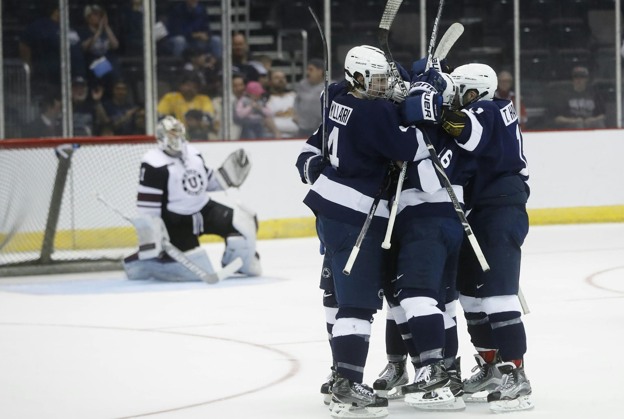 Union goalie Alex Sakellaropoulos, left, stands up as Penn State's Chase Berger and his teammates celebrate his goal during the first period in the regional semifinals of the NCAA college hockey tournament, Saturday, March 25, 2017, in Cincinnati. (AP Photo/John Minchillo)