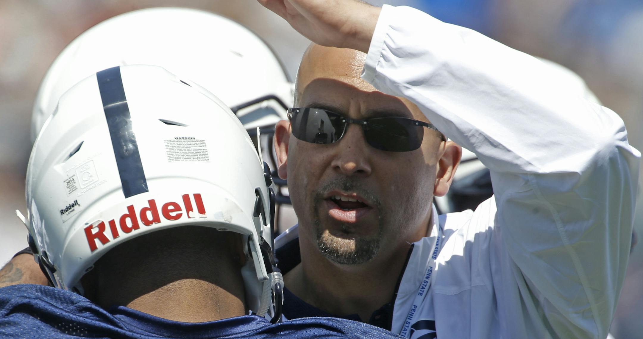 Penn State head coach James Franklin, right, greets running back Bill Belton (1) during warmups before the annual Blue-White NCAA college football scrimmage on Saturday, April 12, 2014, in State College, Pa. (AP Photo/Keith Srakocic) ORG XMIT: PAKS118
