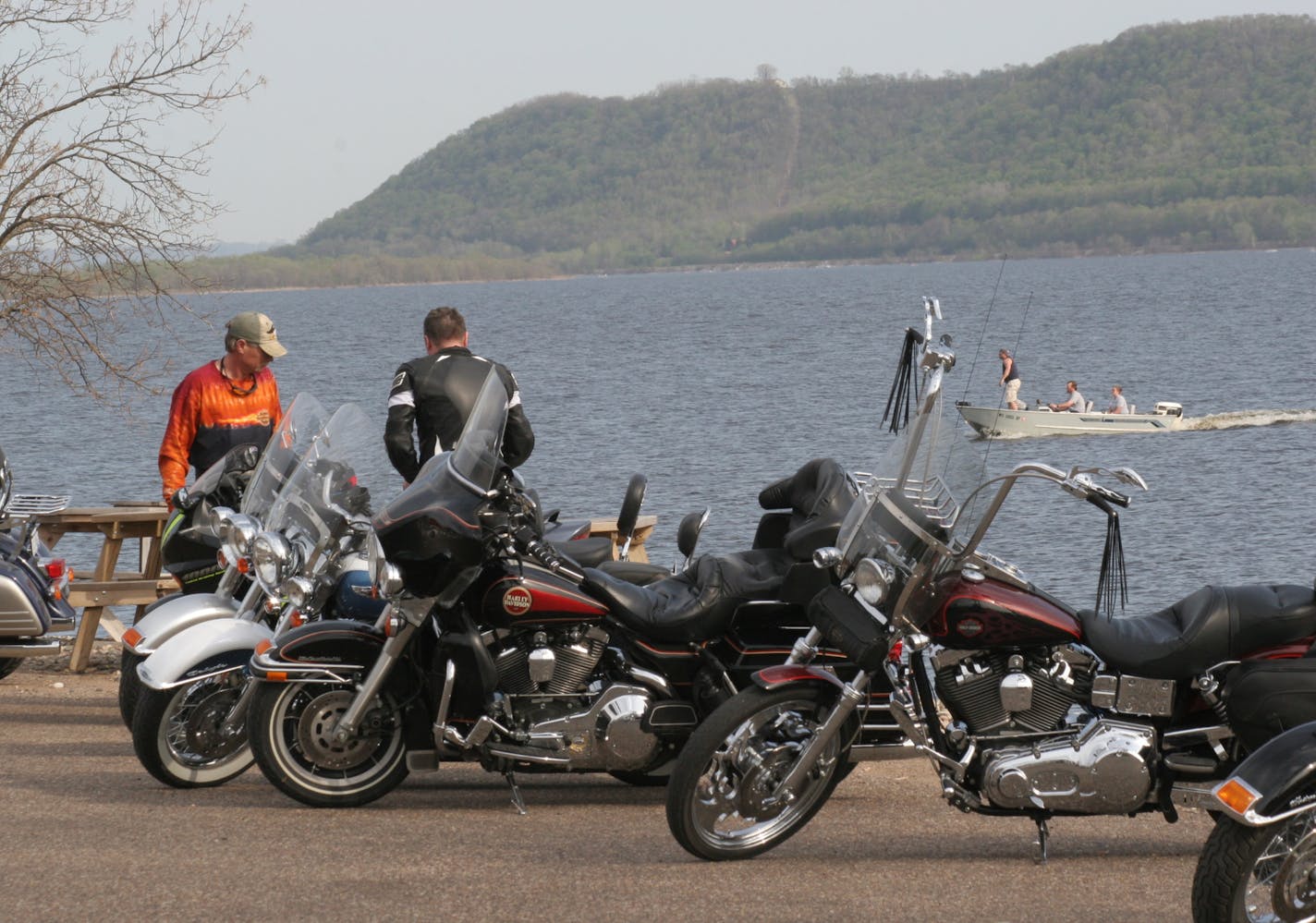 JIM UMEHOEFER Special to the Star Tribune Bikers convene at t acenic spot on the shores of Lake Pepin.