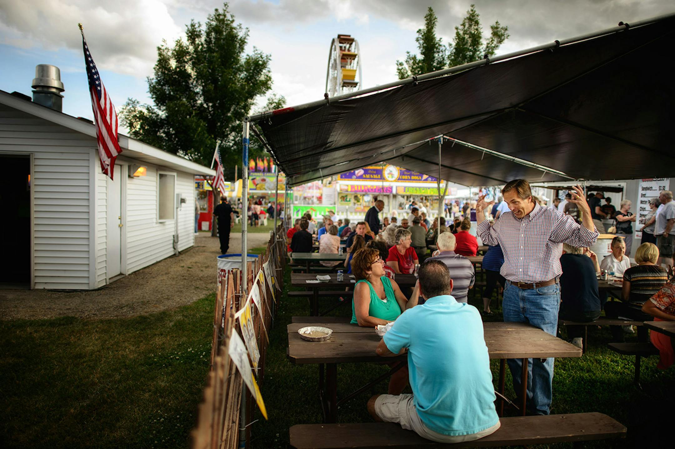 GOP Senate candidate Mike McFadden talked with potential voters in the American Legion area of the Waseca County Free Fair, Wednesday, July 16, 2014. ] GLEN STUBBE * gstubbe@startribune.com