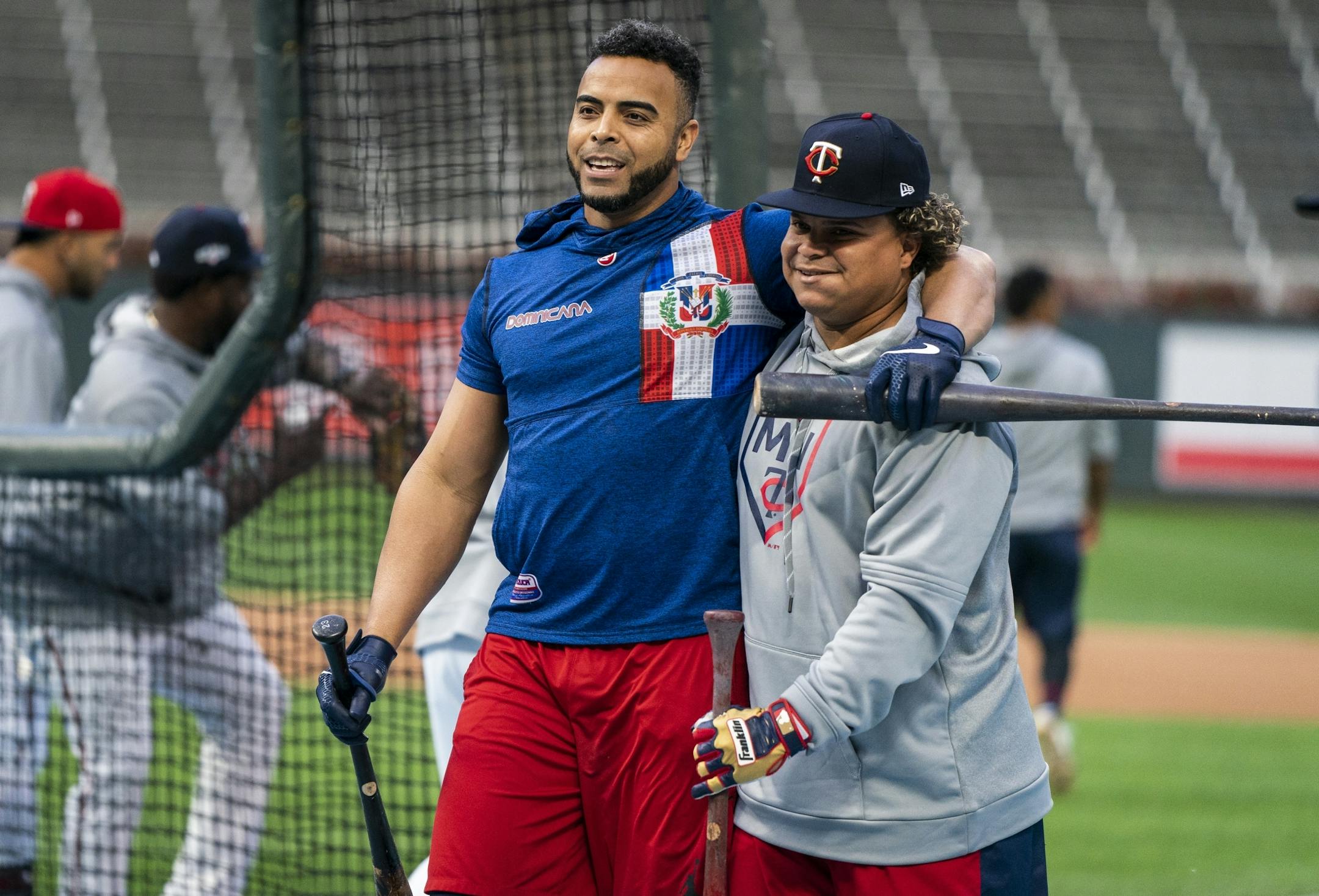 Minnesota Twins designated hitter Nelson Cruz (23), left, and Willians Astudillo shared a jovial moment during the Twins workout.