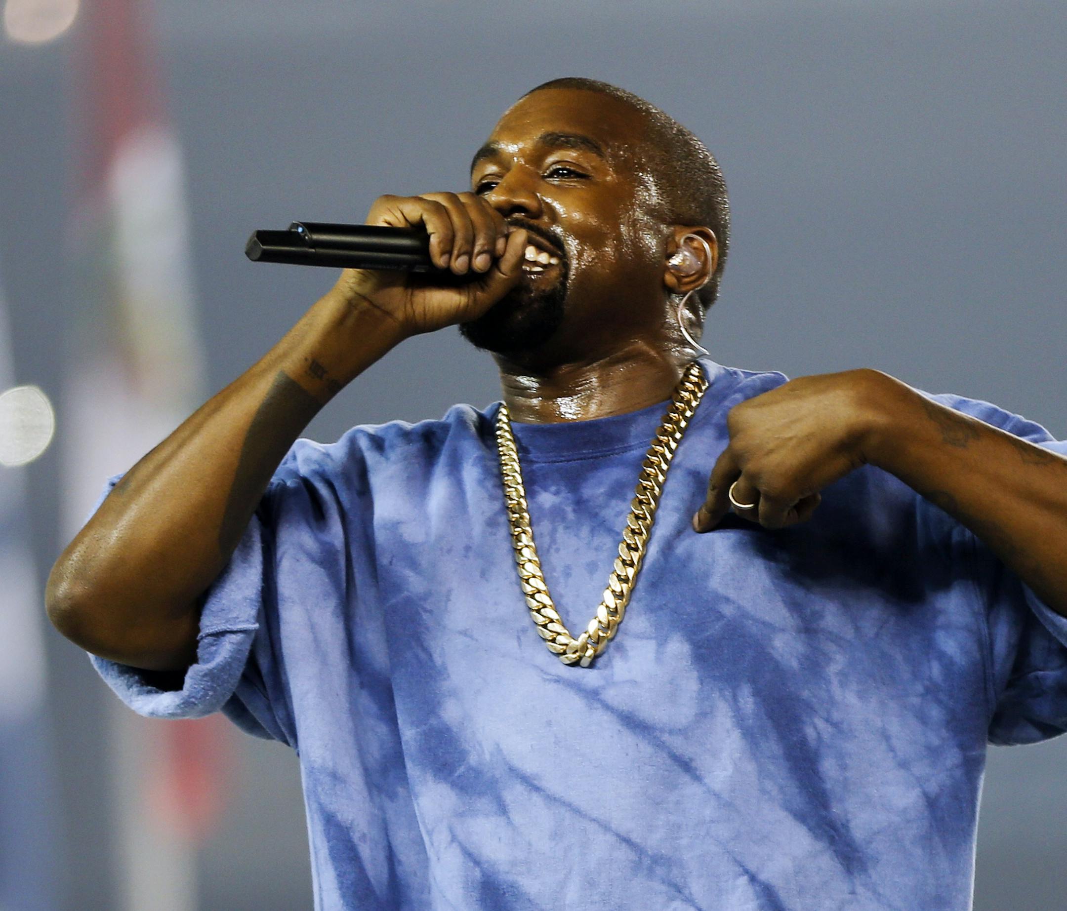 FILE - In this July 26, 2015, file photo, Kanye West performs during the closing ceremony of the Pan Am Games in Toronto. Kanye West, Beck, the Strokes and the Killers are set to perform at the three-day 2016 Governors Ball Music Festival in June. (AP Photo/Julio Cortez, File)