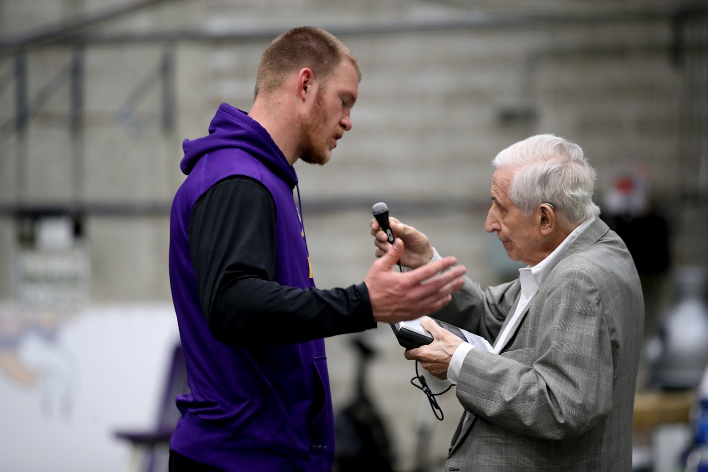 Sid Hartman held up his recording device to interview Minnesota Vikings tight end Kyle Rudolph at Winter Park.