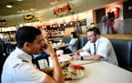 From left, Captain Dylan Brewer, with Air Choice One, and first officer Torrance Hollins, ate lunch in the C Concourse food court before their flight 