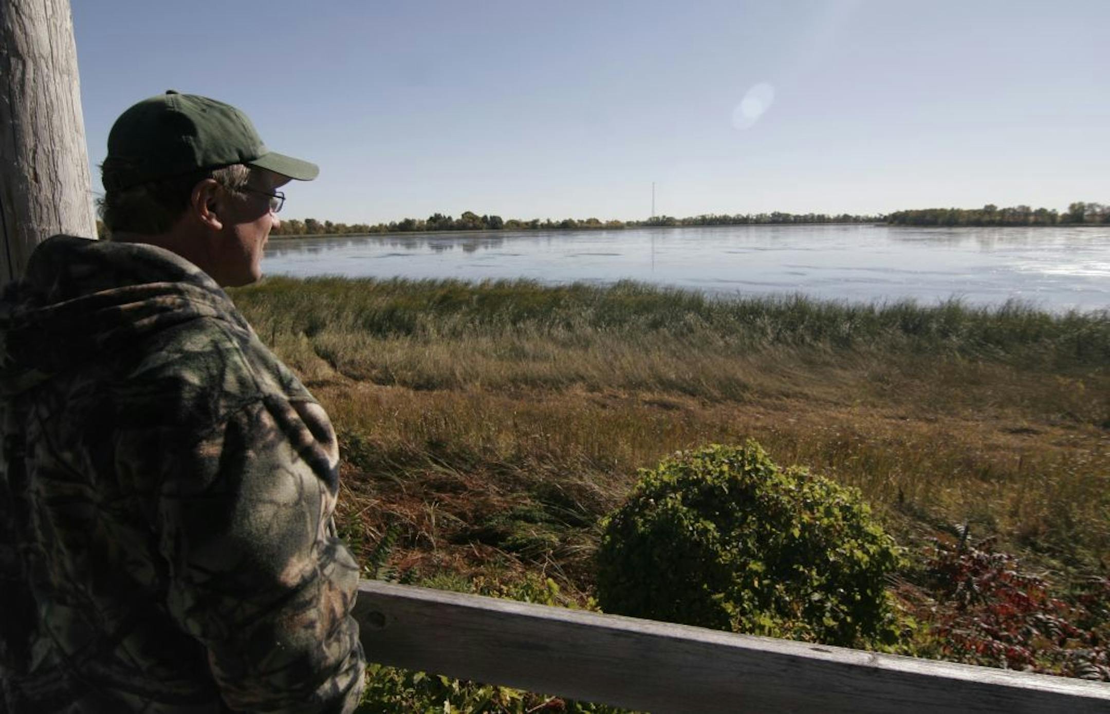 Doug Smith/Star Tribune; Sept. 26, 2012. Dennis Larson looks out over a restored Smith Lake from his property on the small shallow lake in Wright County.