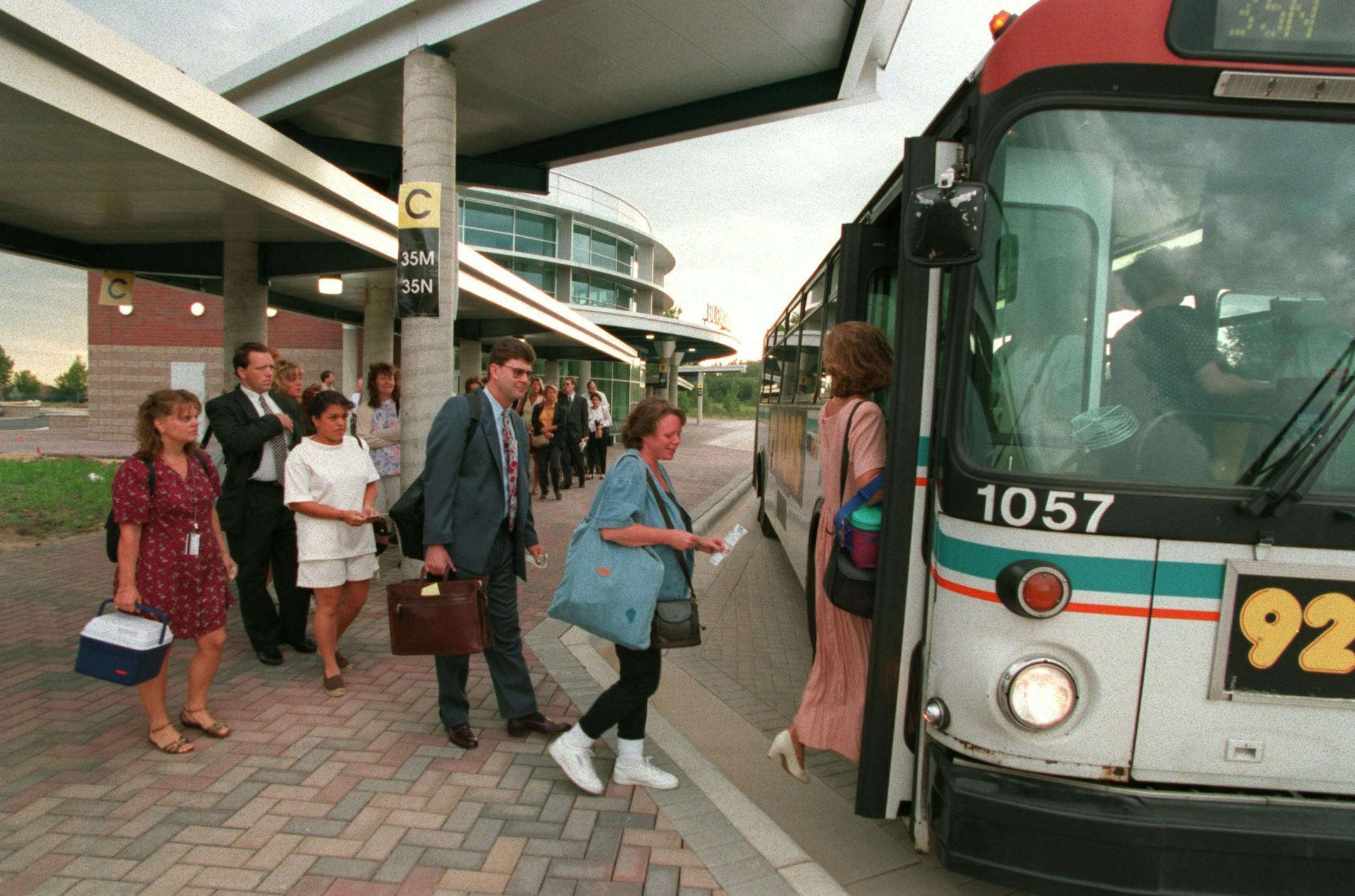 Early morning communters boarded a bus on the first day of operation of the Burnsville Transit Station, about a block east of 35W on Highway 13. Passengers can park their cars in the 600-car capacity lot. One-way fare from this station to downtown Minneapolis is $1.65.
