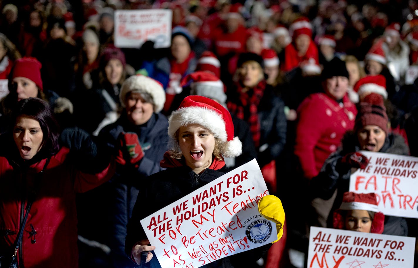 Isabelle Chesness, 17, cheered with teachers and supporters during a rally outside the Anoka-Hennepin district headquarters Monday, December 11, 2023, in Anoka, Minn. ] CARLOS GONZALEZ • carlos.gonzalez@startribune.com