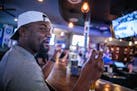 Da-Shon Dixon, who attended law school at Georgia, keeps an eye on game 4 of the Timberwolves against the Nuggets at Irby’s Tavern  in Atlanta on Su