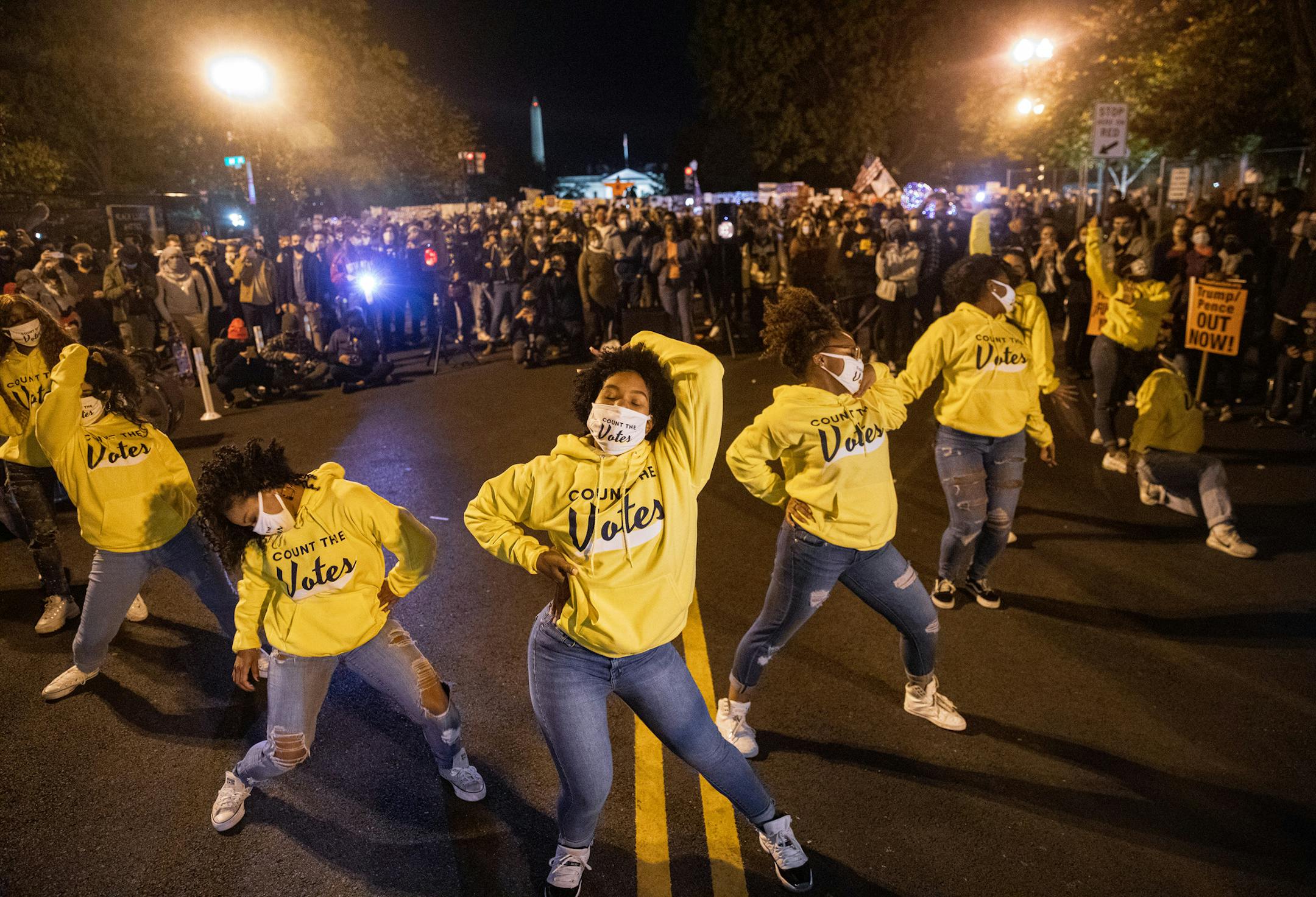 Protestors dance at Black Lives Matter Plaza on Election Day in Washington, Tuesday, Nov. 3, 2020. (Amr Alfiky/The New York Times)