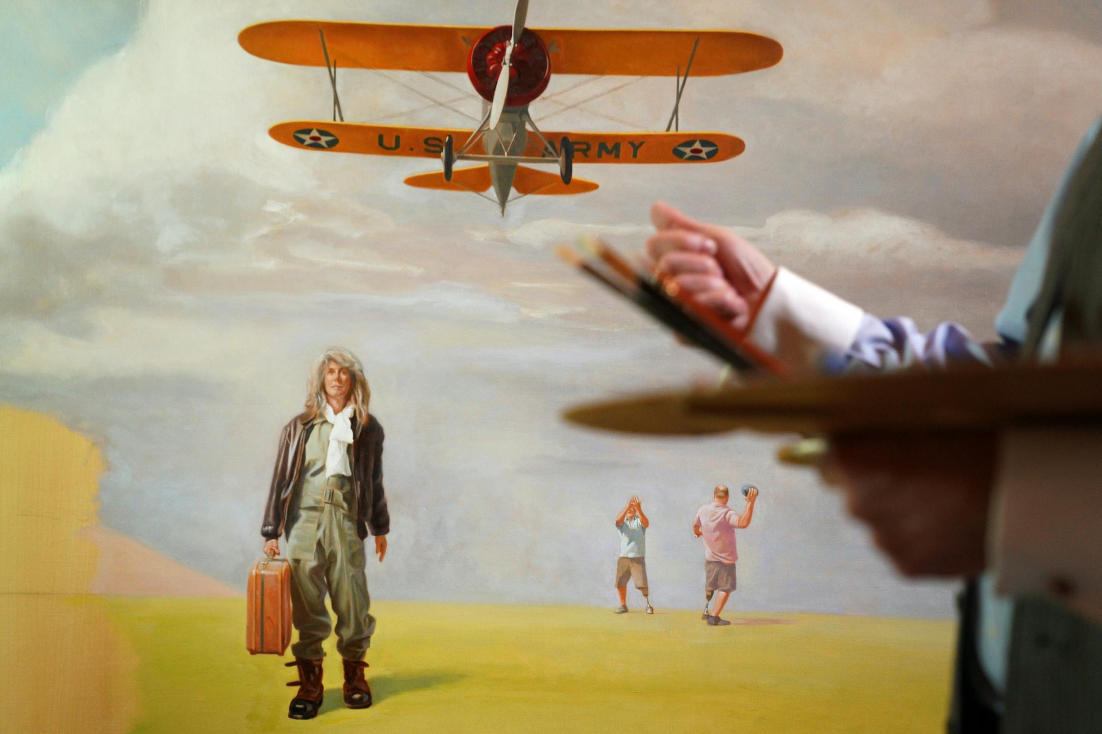 Artist Charles Gilbert Kapsner's wife posed as a model for a figure, at left, in the last of five murals for his 10-year U.S. war veterans project at his studio in Little Falls. The two men pictured at right are both missing limbs, am homage to the many amputees caused by war injuries.