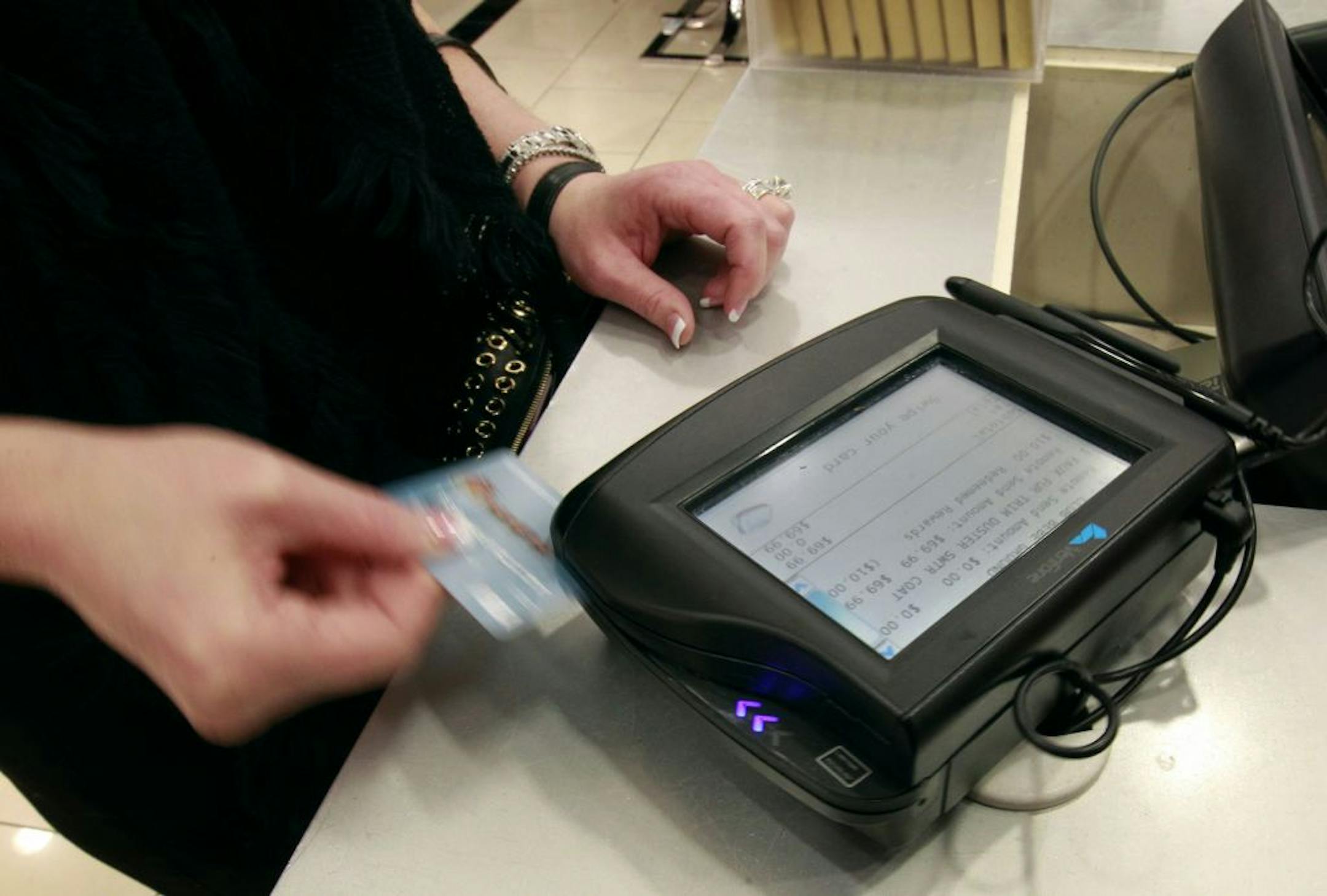 Credit card debt is growing and the U.S. savings rate is falling as more consumers become optimistic and open their wallets.