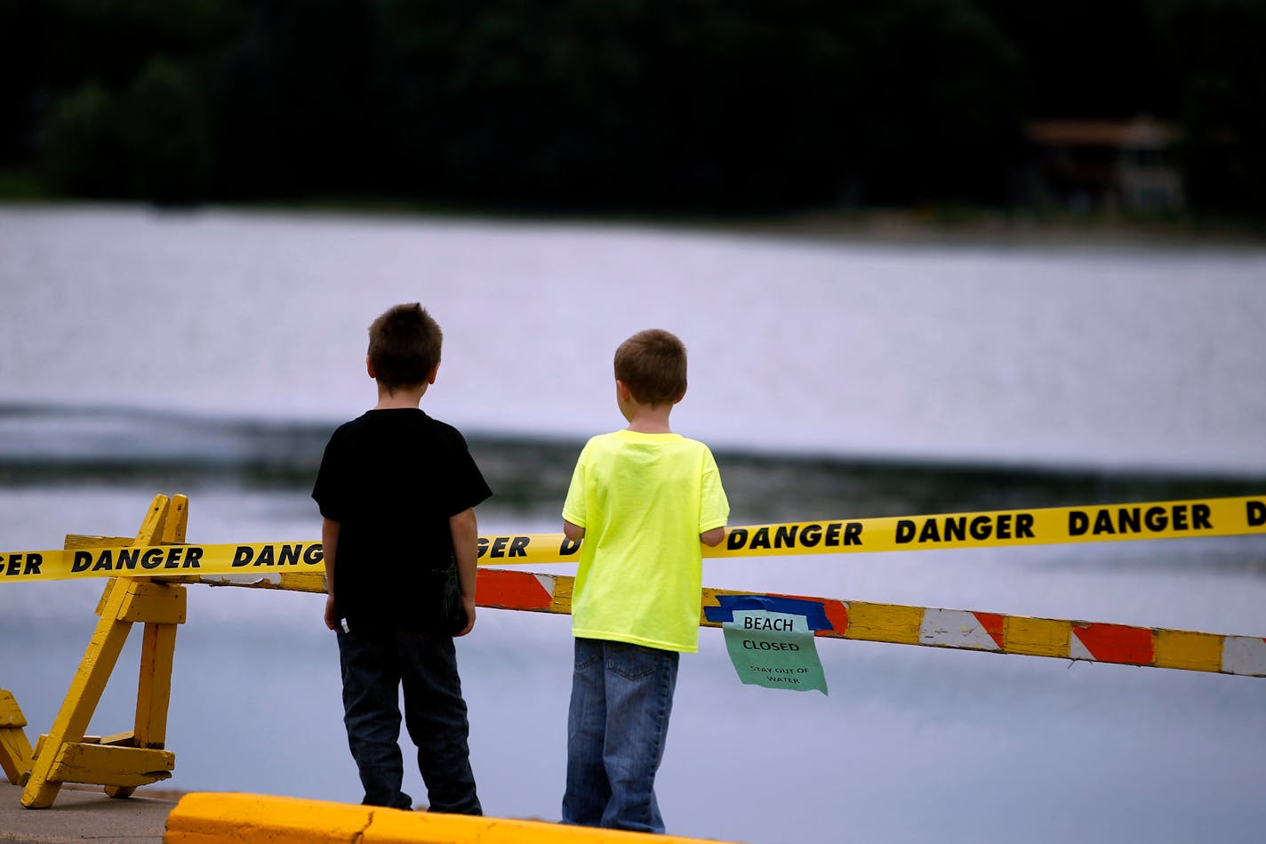 The beach at Lily Lake in Stillwater was taped off Wednesday, one day after a boy died from a brain infection linked to an amoeba in the water.