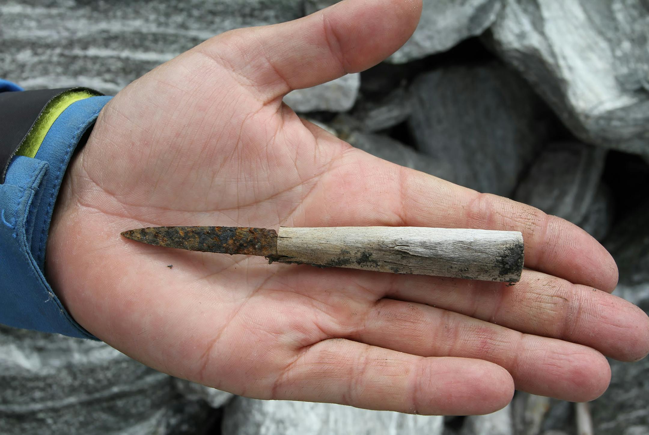 In a photo provided by Secretsoftheice.com, a small and worn knife, found in the Lendbreen mountain pass. Melting ice has receded from a mountain pass in Norway, unearthing pelts, shoes and stone structures from thousands of years ago. (Secretsoftheice.com via The New York Times) NO SALES; FOR EDITORIAL USE ONLY WITH NYT STORY SCI-VIKING-ARTIFACTS BY LIBELL AND HAUSER FOR APRIL 27, 2020. ALL OTHER USE PROHIBITED.