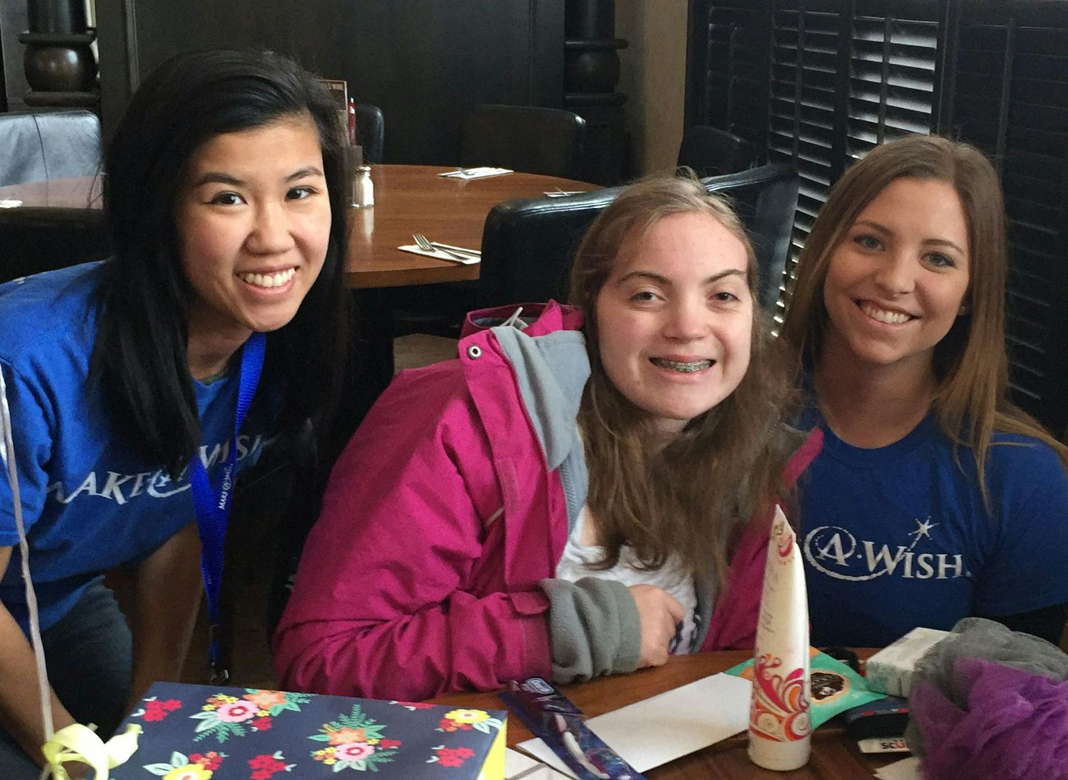 Make a Wish volunteers Ellyn Dam, left, and Jill Smith, right, and Carolyn Colebeck, center