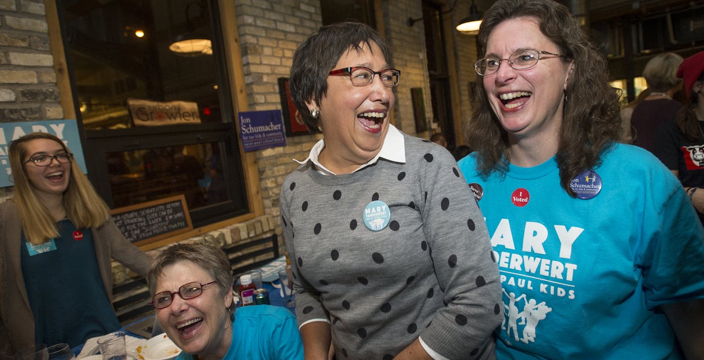 Saint Paul School Board candidate Mary Vanderwert, center, celebrated with supporters Kathy Magnuson, bottom left, and Barb Spears as results continued to indicate a win for Vanderwert Tuesday night at the DFL's election party at Urban Growler. ] (AARON LAVINSKY/STAR TRIBUNE) aaron.lavinsky@startribune.com All seven of St. Paul's City Council seats are up for election, including two open wards where incumbents didn't run again. As many as three who have challenged Mayor Chris Coleman's goals and