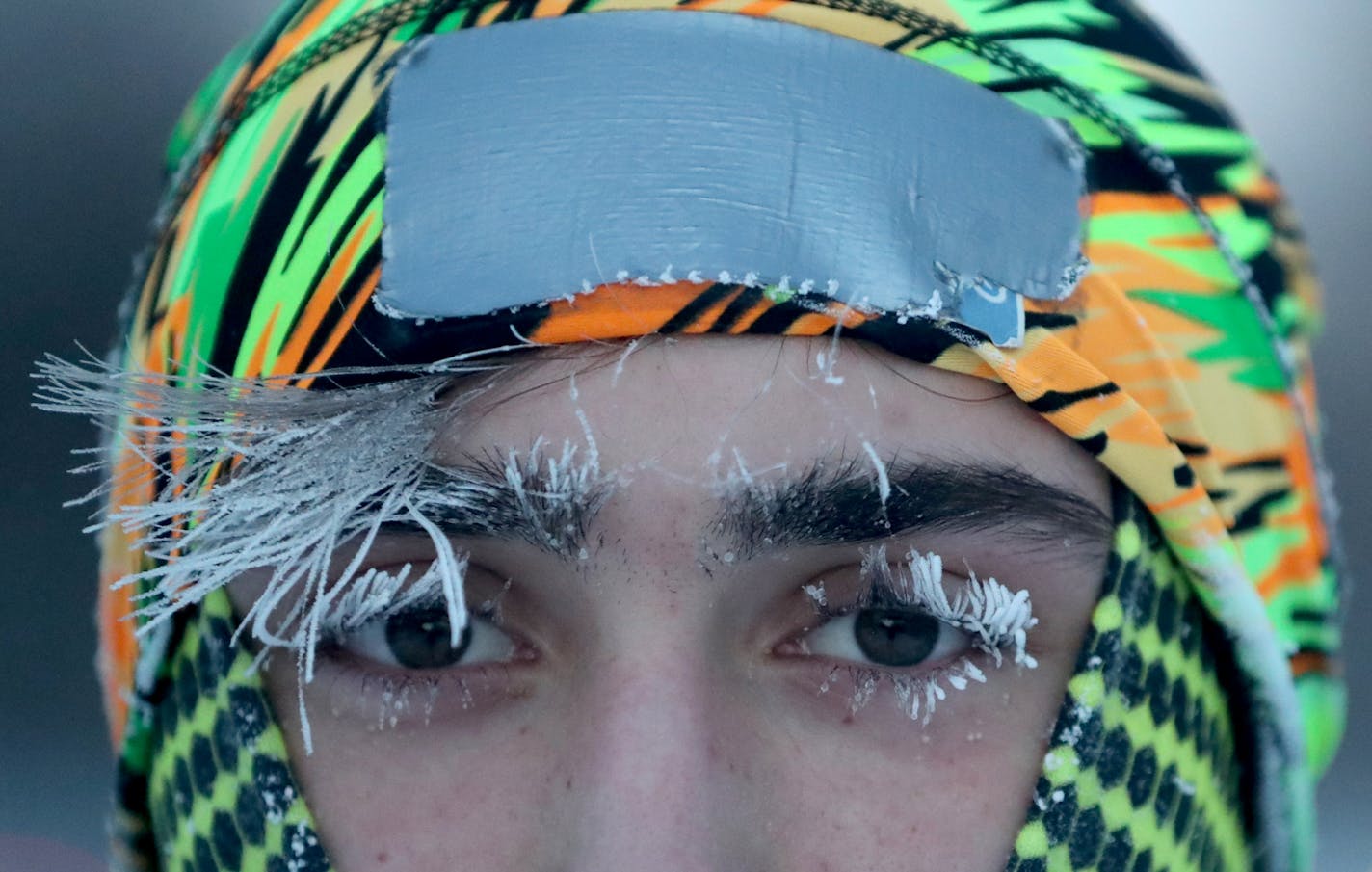 University of Minnesota student Daniel Dylla was frosted in the morning cold while pausing from a jog along the Mississippi River.