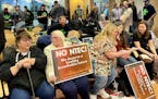 Opponents and supporters of a proposed gas-fired power plant in Superior, Wis., filled a city planning commission meeting Wednesday night.
