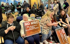 Opponents and supporters of a proposed gas-fired power plant in Superior, Wis., filled a city planning commission meeting Wednesday night.