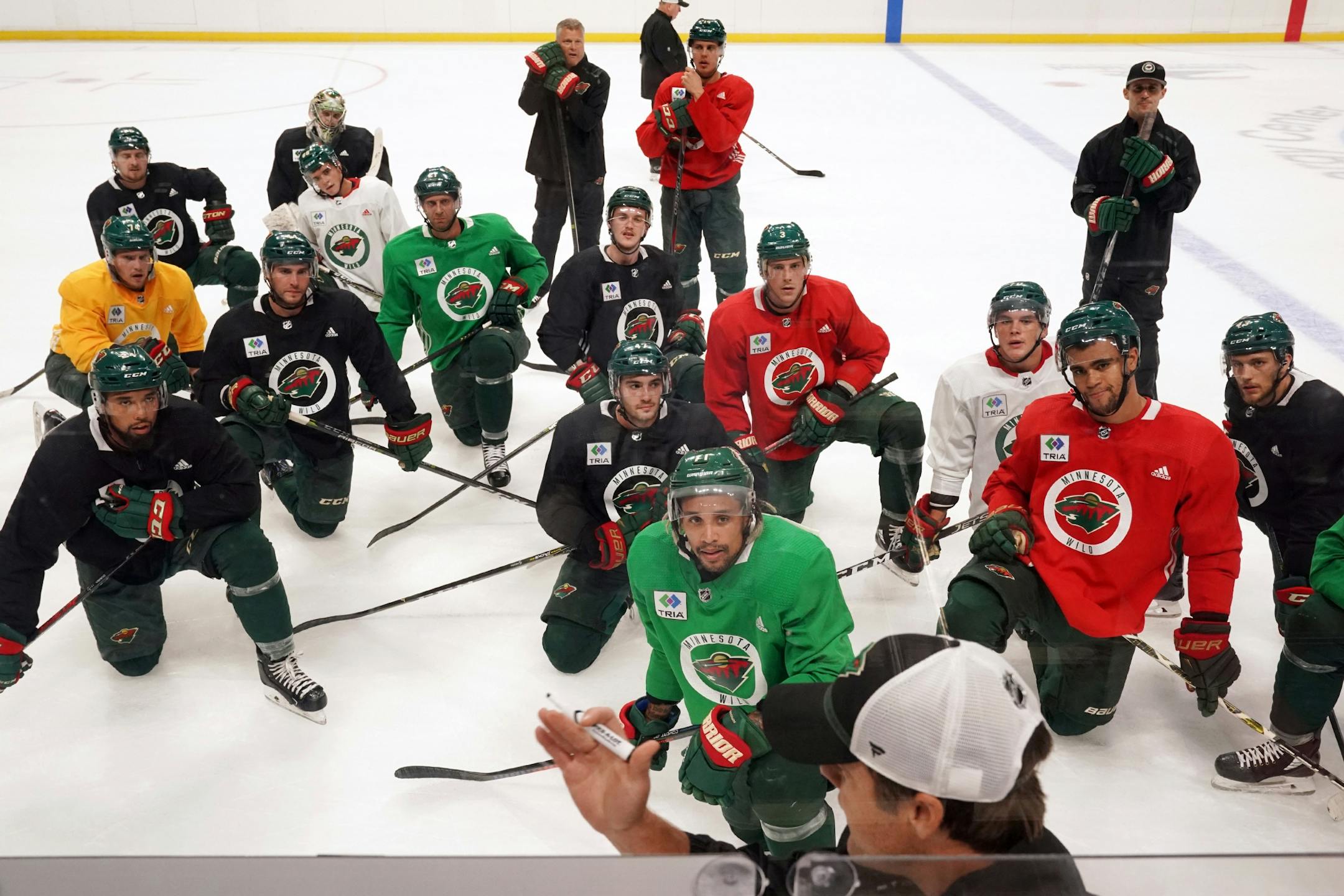 Minnesota Wild players listened as they were given directions on their next drill.