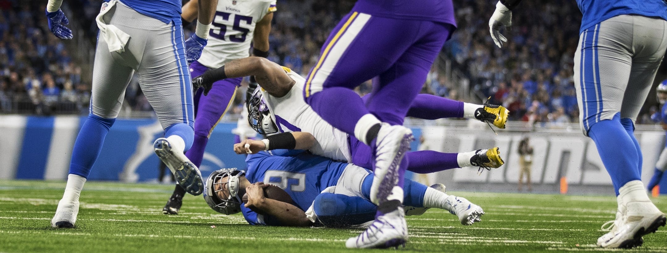 Detroit Lions quarterback Matthew Stafford (9) was sacked by Minnesota Vikings defensive end Everson Griffen (97) in the third quarter at Ford Field Sunday December 23, 2018 in Detroit, MI.