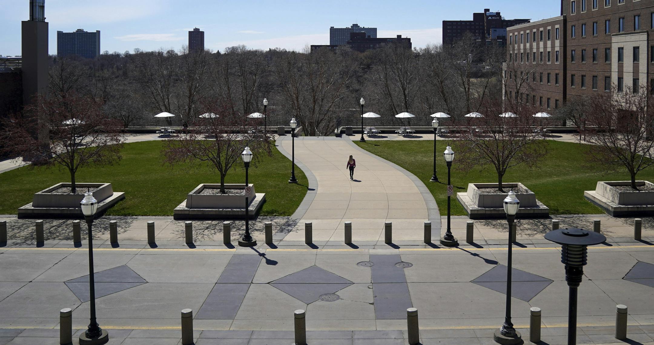 The University of Minnesota was mostly deserted Tuesday afternoon, April 21, 2020, in Minneapolis, as the university announced it will freeze tuition for most students at its five campuses in the next academic year to provide financial relief to current students and help lure in new students during the pandemic. (Glenn Stubbe/Star Tribune via AP)