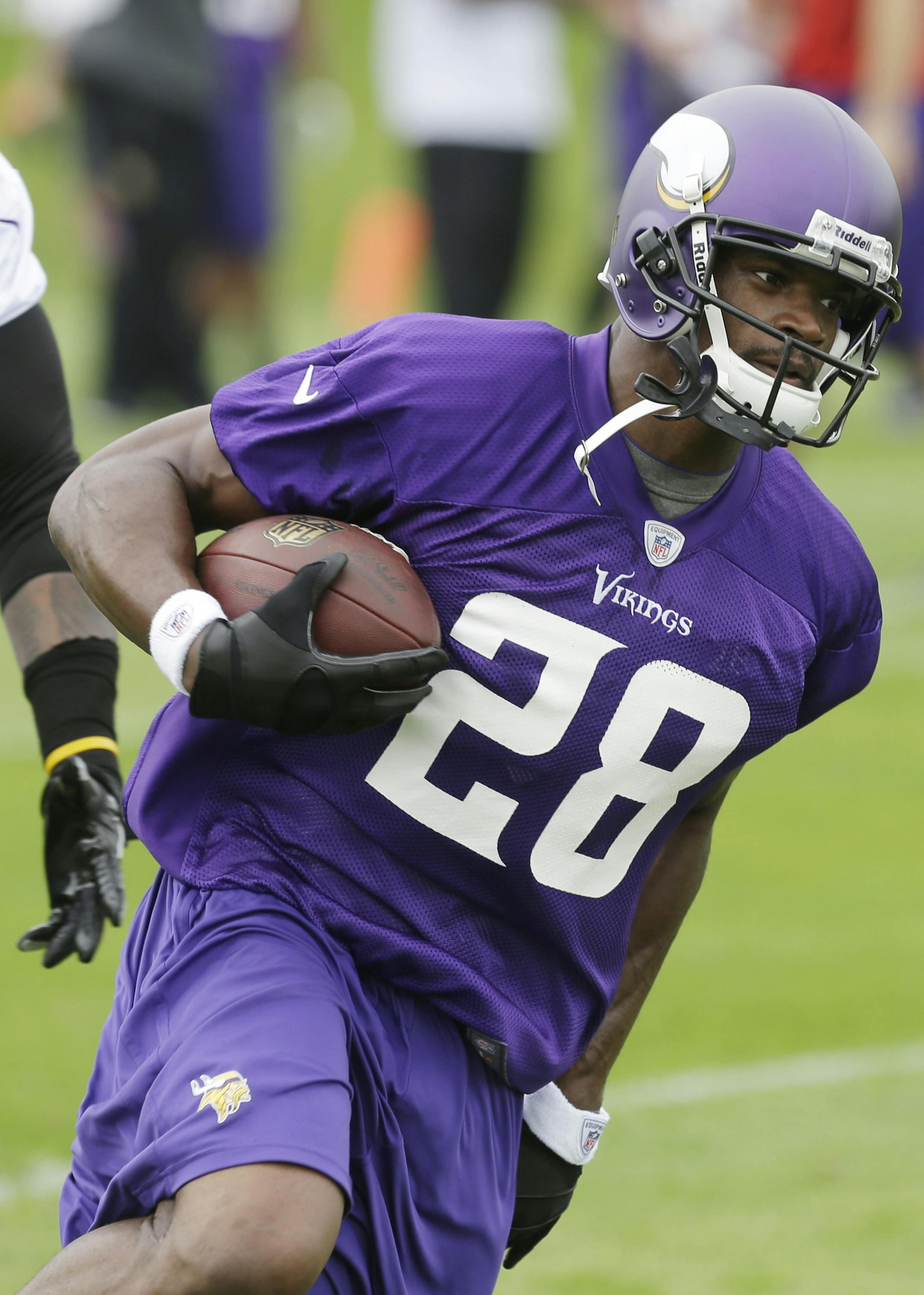 Minnesota Vikings running back Adrian Peterson (28) is shown during Organized Team Activities (OTA) Wednesday, May 29, 2013 in Eden Prairie, Minn. (AP Photo/Jim Mone)