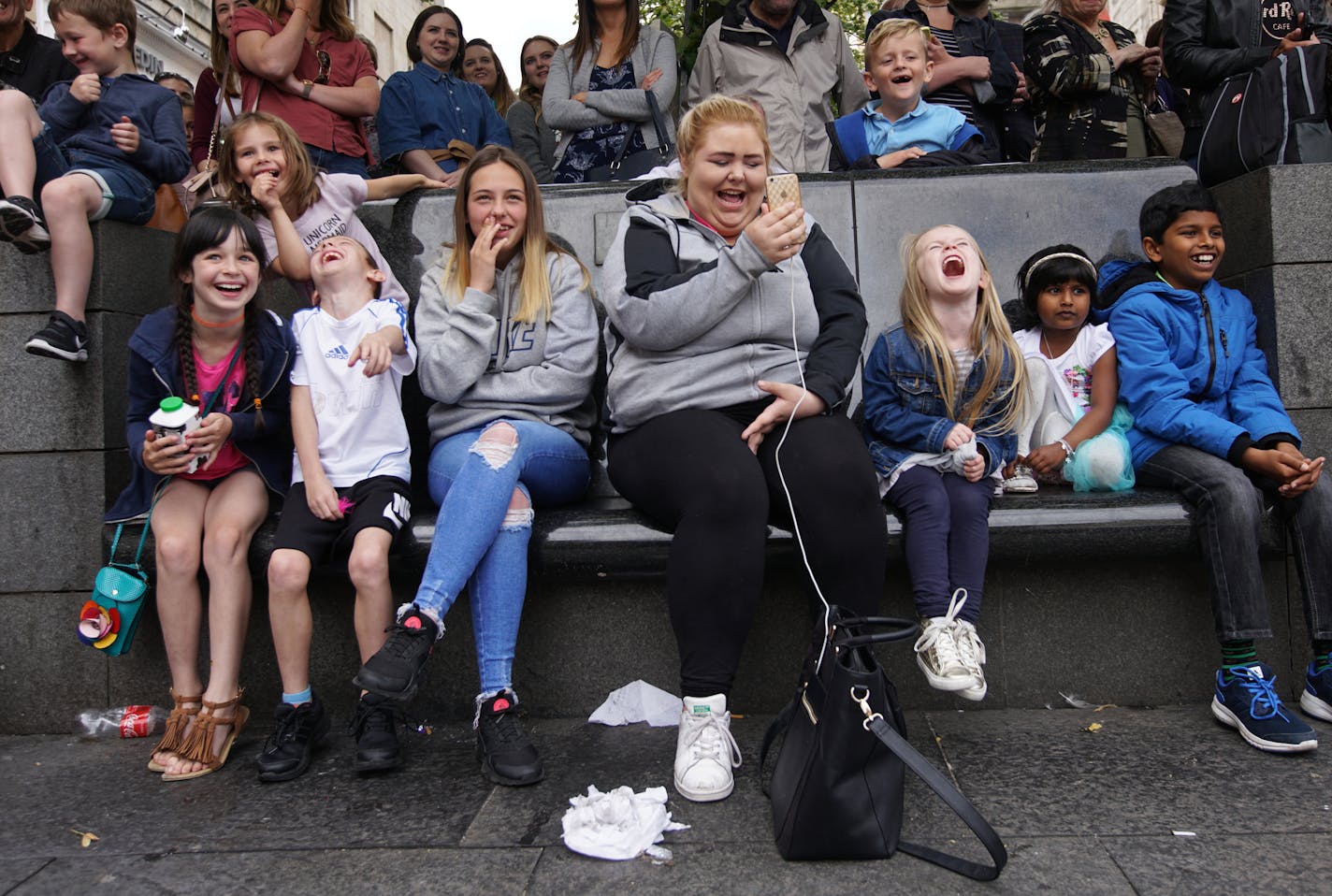 The audience laughs at street performers just off the Royal Mile during the 70th edition of the Edinburgh Fringe Festival in Scotland, Aug. 13, 2017. Edinburgh&#xd5;s Fringe festival has become the world&#xd5;s biggest arts extravaganza. Some say it is too big, too costly and maybe even too funny. (Jane Stockdale/The New York Times) ORG XMIT: XNYT59