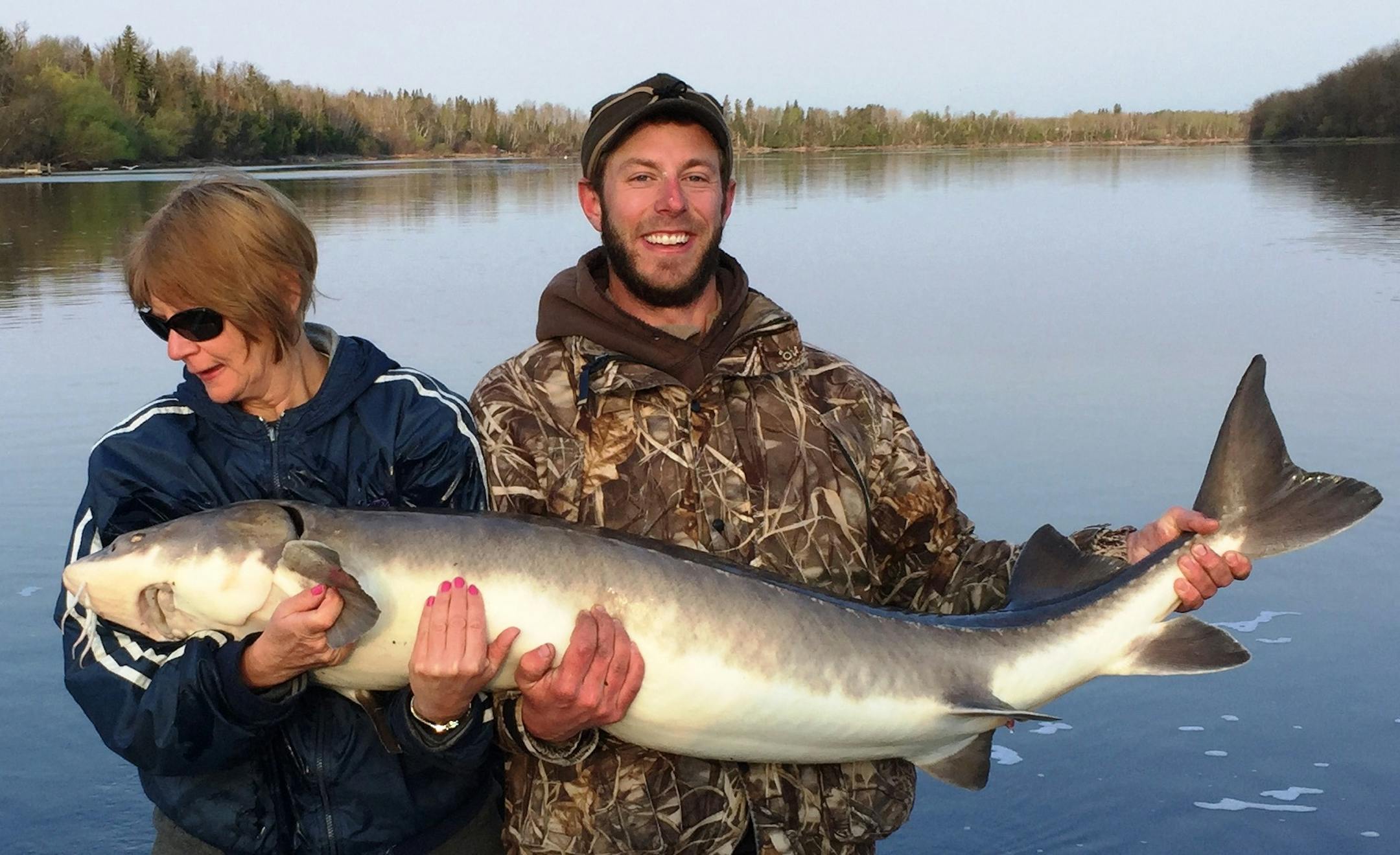 Cindy Pawlowski of Frazee caught and released the record lake sturgeon May 8 on the Rainy River in Koochiching County. The fish was 62⅞ inches long with a 29-inch girth, and took a gob of night crawlers at 7 a.m. Photo courtesy Department of Natural Resources.