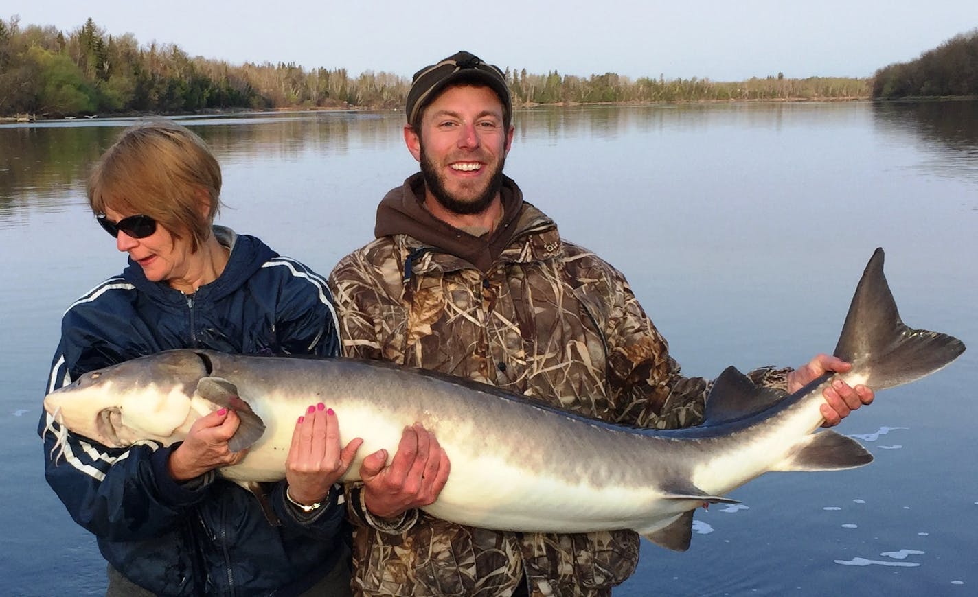 Cindy Pawlowski of Frazee caught and released the record lake sturgeon May 8 on the Rainy River in Koochiching County. The fish was 62&#x215e; inches long with a 29-inch girth, and took a gob of night crawlers at 7 a.m. Photo courtesy Department of Natural Resources.