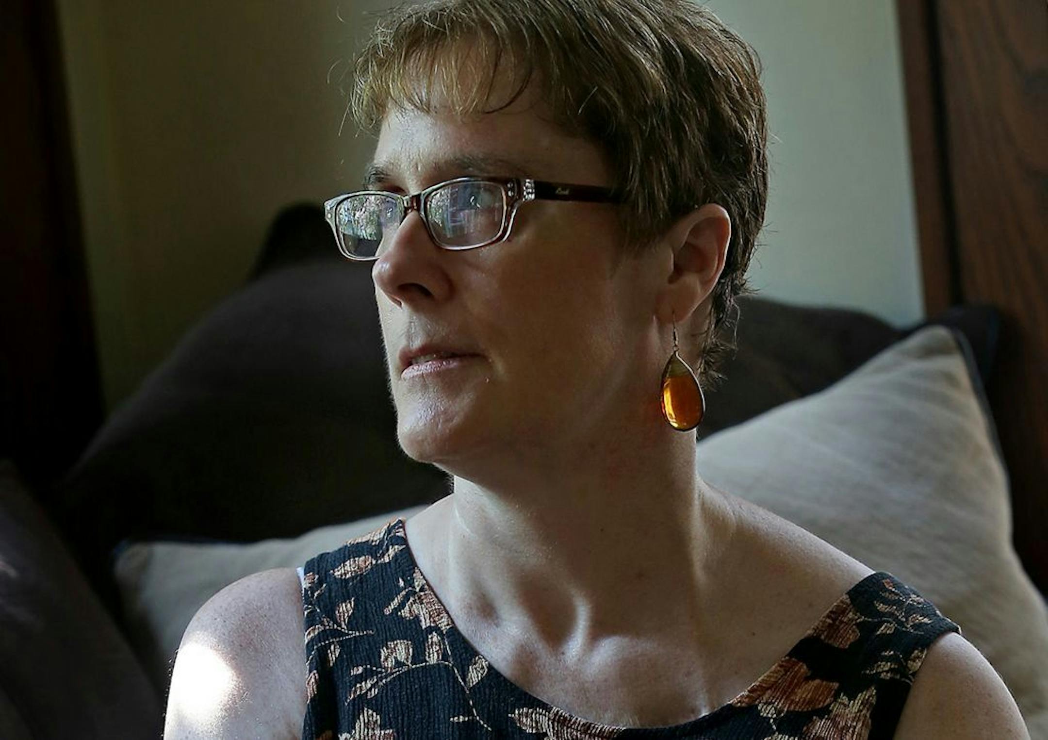 Jackie Hunt-Christensen, who has Parkinson's disease and also has struggled with depression since childhood, has been a national advocate regarding Parkinson's disease, but lately her ability to travel and her mobility has decreased due to Parkinson's symptoms. Here Hunt-Christensen is photographed in her south Minneapolis home, Wednesday, August 20, 2014. She said her grandmother committed suicide when Hunt-Christensen was 5-years-old.
