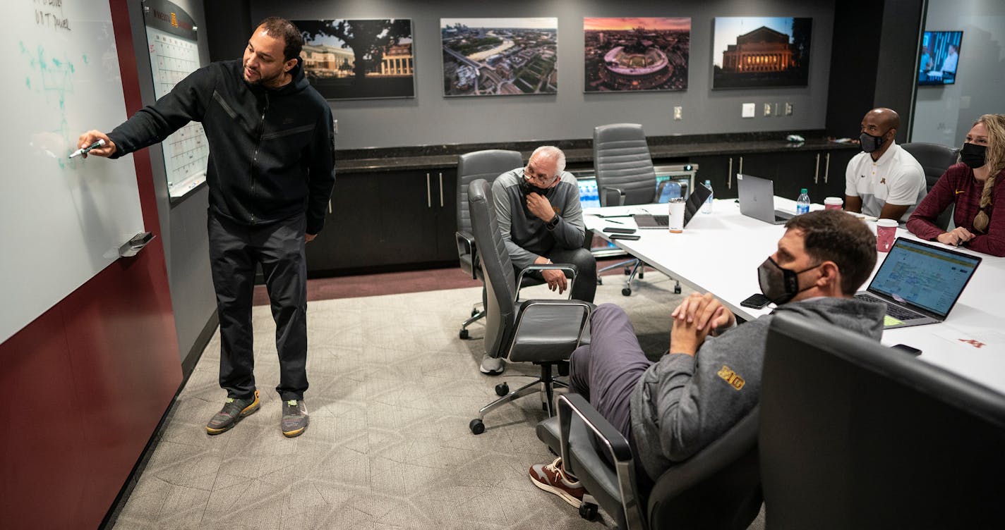 University of Minnesota first year basketball coach Ben Johnson , wrote practice plays on the board with his coaching staff Ryan Livingston left, Dave Thorson, Jason Kemp, Kelsey Steinhagen in Athlete's Village, in Minneapolis, Minn., on Monday, Oct. 4, 2021. This is Ben Johnson first year as the head basketball coach at the University of Minnesota. Johnson played two season with the Gophers and was a two-time captain at Minnesota. ] JERRY HOLT •Jerry.Holt@startribune.com