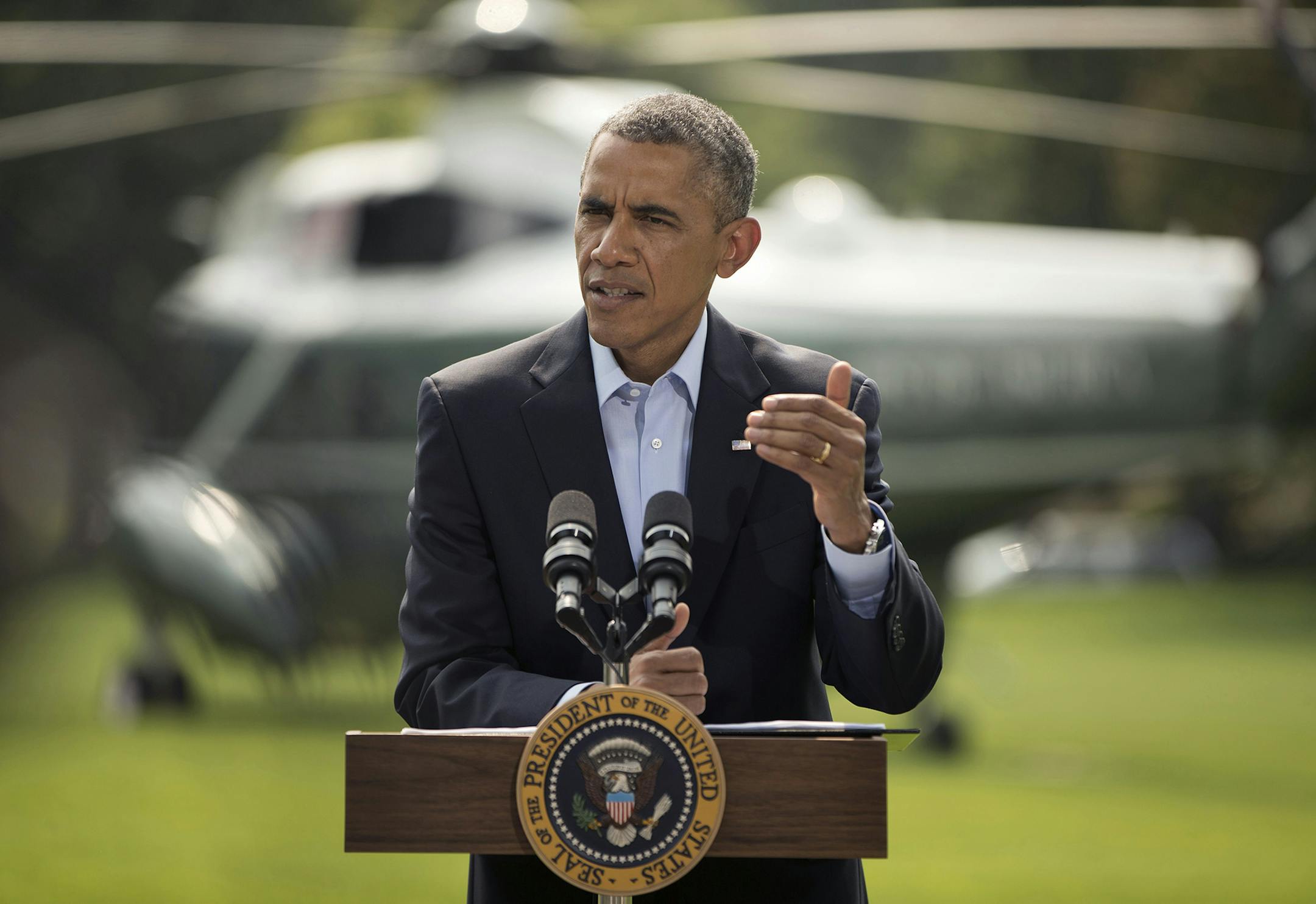 President Barack Obama speaks on the South Lawn of the White House in Washington, Saturday, Aug. 9, 2014, about ongoing situation in Iraq before his departure on Marine One for a vacation in Martha's Vineyard. Obama announced late Thursday that he had ordered military airstrikes in northern Iraq to hold off Islamic State forces advancing on the Kurdish capital of Irbil. Obama also ordered airdrops of food and water to member of a religious minority group who fled into the mountains to escape the