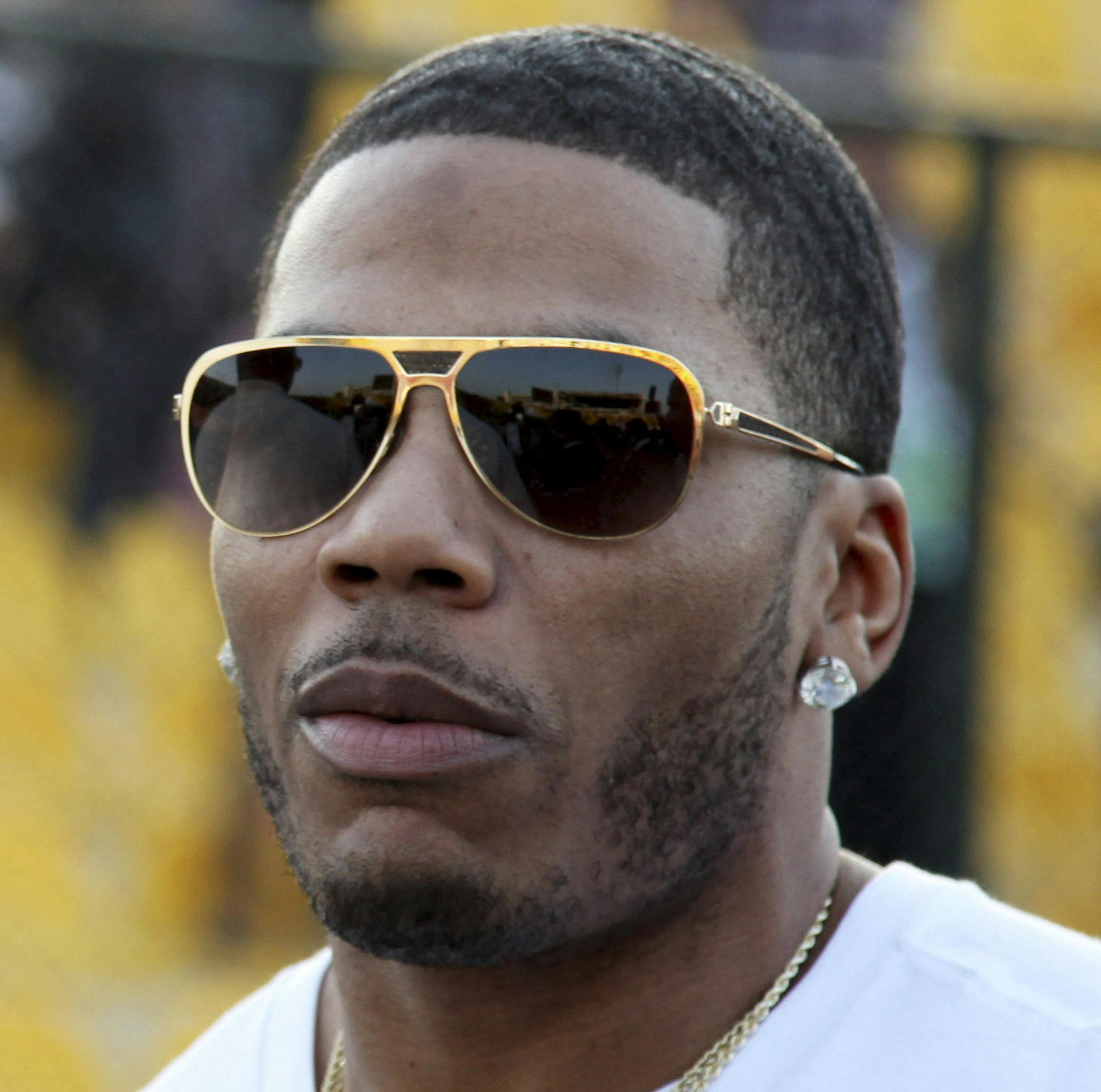 FILE- In March 13, 2015, file photo, U.S. rapper Nelly approaches the stage for a concert in Irbil, northern Iraq. Nelly is facing felony drug charges after being arrested in Tennessee, Saturday, April 11, 2015, according to a Tennessee Highway Patrol news release. (AP Photo/Seivan M. Salim, File)