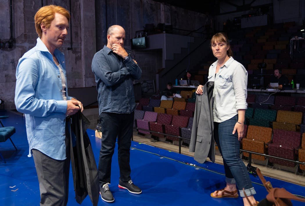 Matt Riehle, who portrays husband Dan, artistic director Peter Rothstein and costume supervisor Amber Brown during a rehearsal of “Next to Normal.”