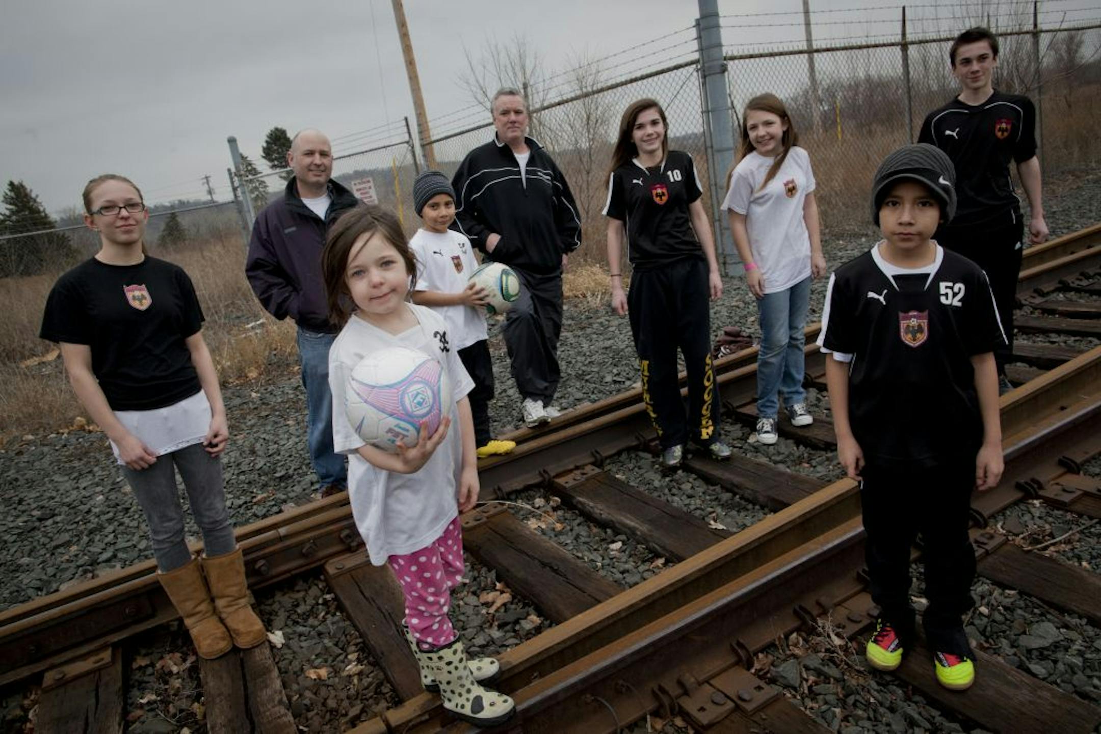 Hal Clapp, the man in back at right, stood with others involved with the Blackhawks Soccer Club near where some want the city of St. Paul to build soccer fields.