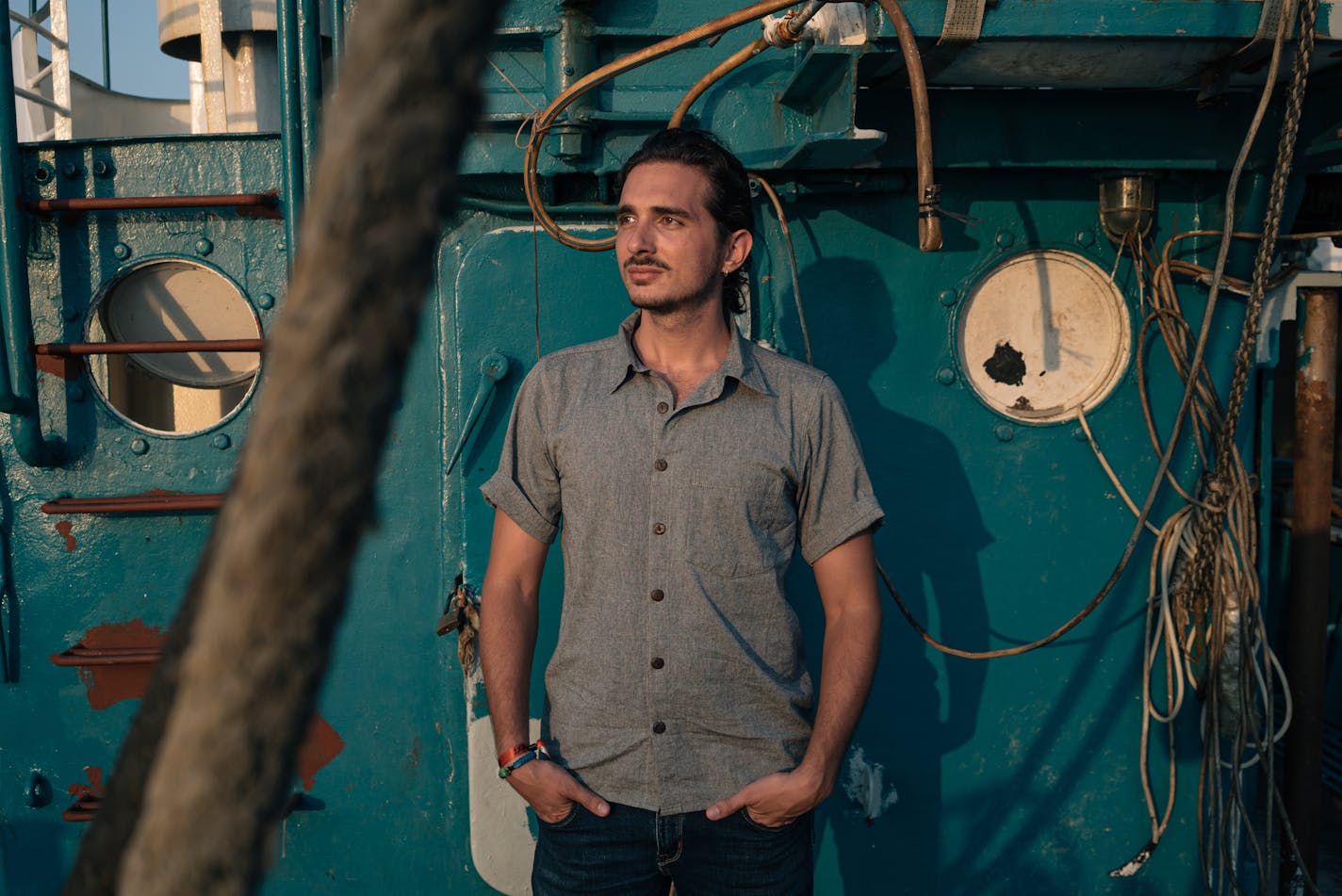 Lefteris Arapakis aboard the Panagiota II, his father's fishing boat, in Keratsini, Greece, on July 25. MUST CREDIT: Photo by Alice Martins for The Washington Post.