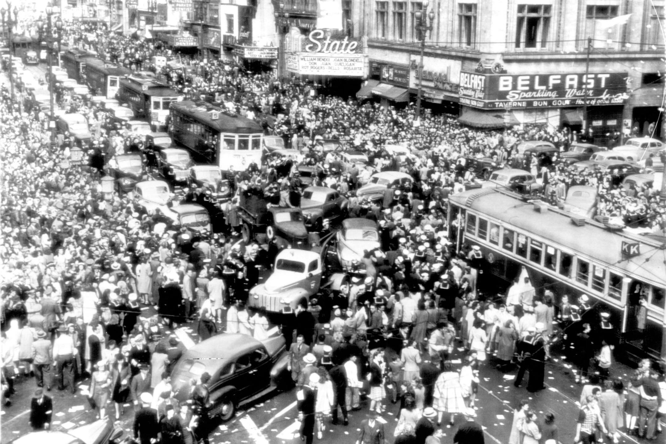August 14, 1945 CELEBRATE OFFICIAL REPORT -- Throngs Fill Market street here today celebrating the announcement by President Truman of the Surrender of Japan to the Allies. Within minutes of the announcement, street cars and autos are unable to move in this traffic jam. AP Wirephoto ORG XMIT: MIN2015080713225225