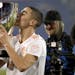 Atlanta United midfielder Miguel Almiron kisses the Eastern Conference trophy after the team won the MLS soccer Eastern Conference championship on, No