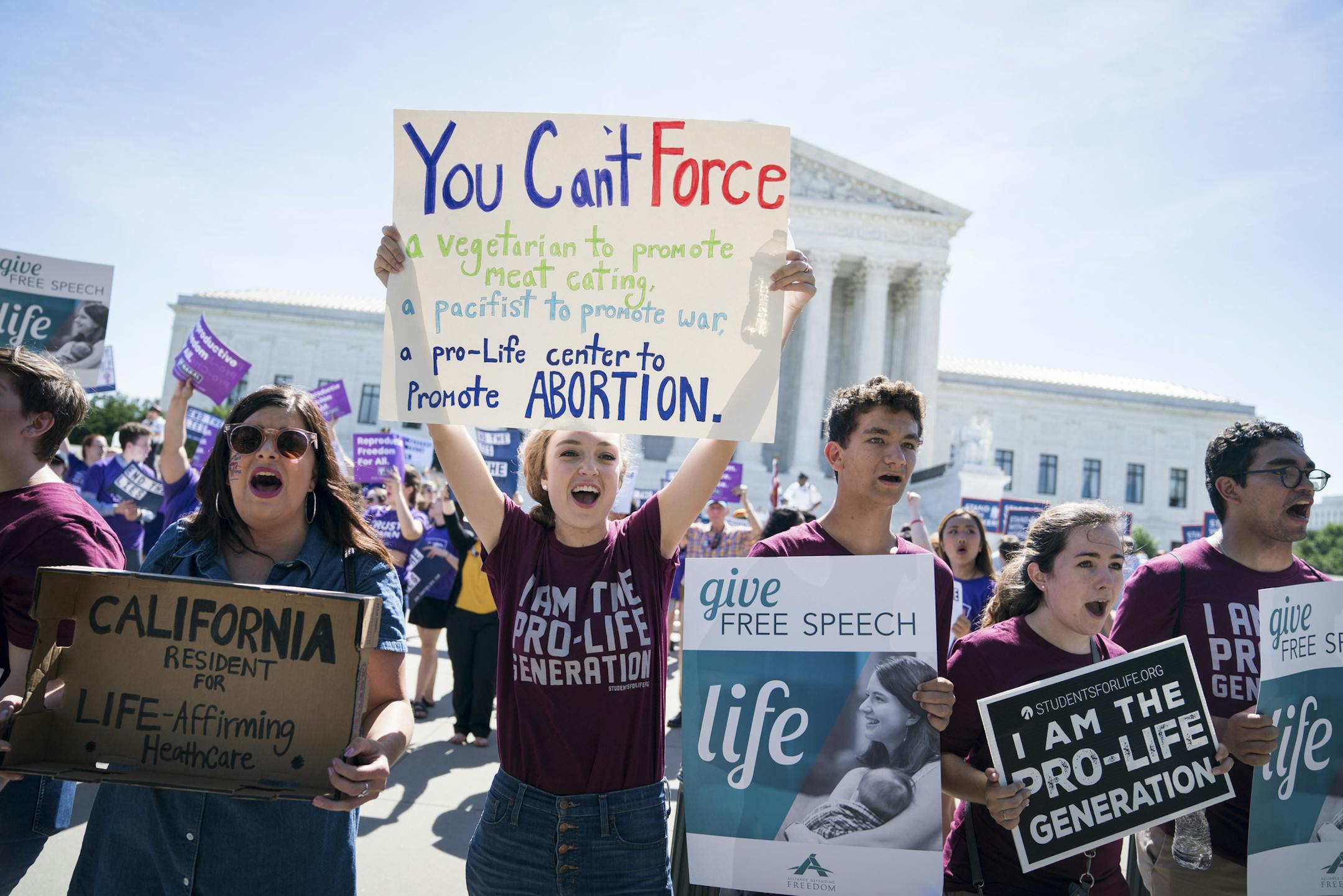 Demonstrators opposed to abortion outside the U.S. Supreme Court building in Washington, June 26, 2018. A state law requiring “crisis pregnancy centers” to supply women with information about abortion likely violates the First Amendment, the Supreme Court ruled on Tuesday in blocking the law. The case, National Institute of Family and Life Advocates v. Becerra, concerned a California law that requires centers operated by opponents of abortion to provide women with information about