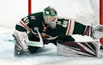 Minnesota Wild goaltender Devan Dubnyk (40) stretches out to make a save in the second period against the Calgary Flames on Saturday, Dec. 15, 2018, a