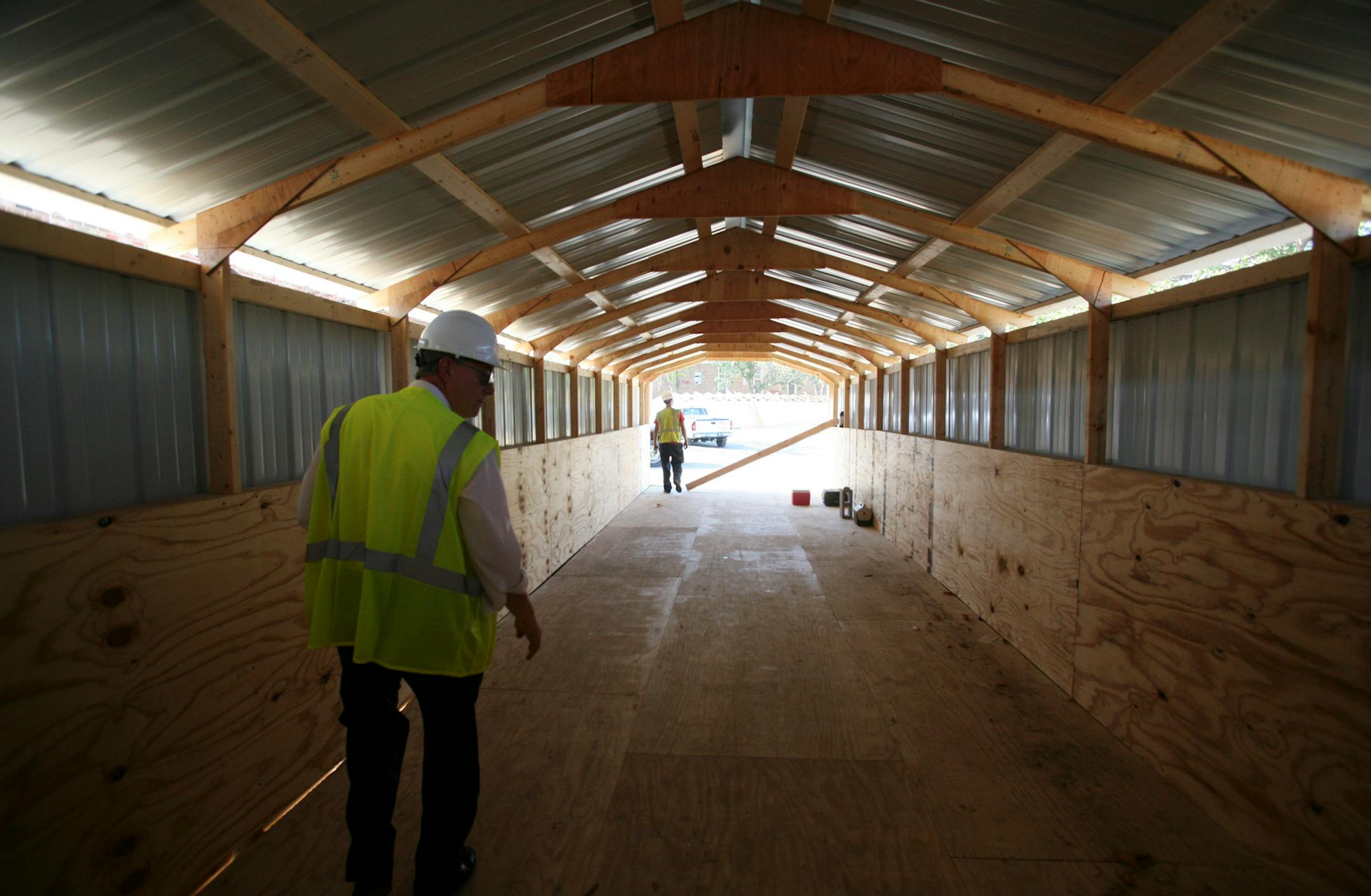 Covered walkways are a part of the temporary construction of Spring Lake Park High School to help students travel in all weather between the three main buildings the high school will be made up of this coming schoool year.