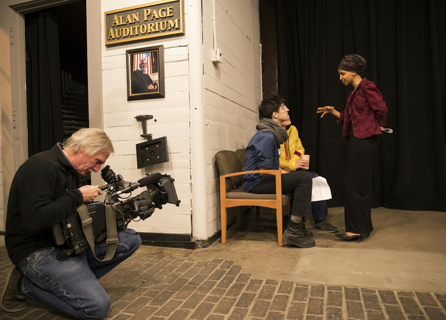 Rep. Ilhan Omar chatted with Eric Highers, 26, of Minneapolis, in blue coat, and Brandan Hebert, 20, of St. Paul as she was filmed by the Today Show at a forum at Mixed Blood Theatre aimed at providing residents of her House district "the necessary tools to protect and organize our communities" in "the wake of the new presidential administration's policies." on Wednesday, February 15, 2017 in Minneapolis, Minn. ] RENEE JONES SCHNEIDER &#x2022; renee.jones@startribune.com