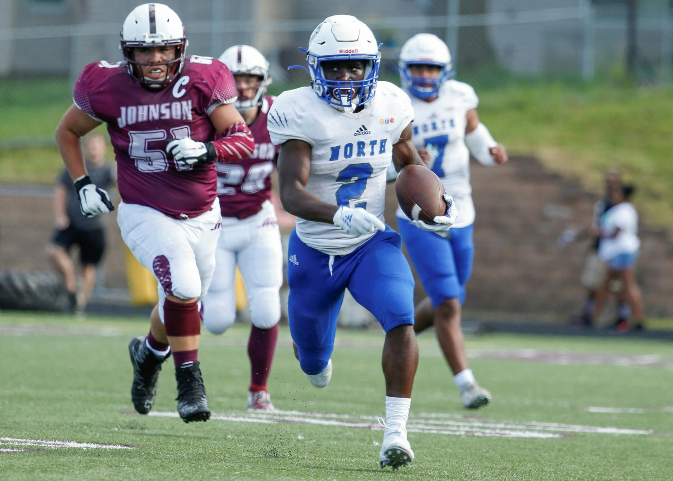 Minneapolis North's Terrance Kamara sprints down the sideline on a second quarter run against St. Paul Johnson. Kamara scored North’s first touchdown to give the Polars an early 6-0 lead over the Governors. Photo by Jeff Lawler, SportsEngine