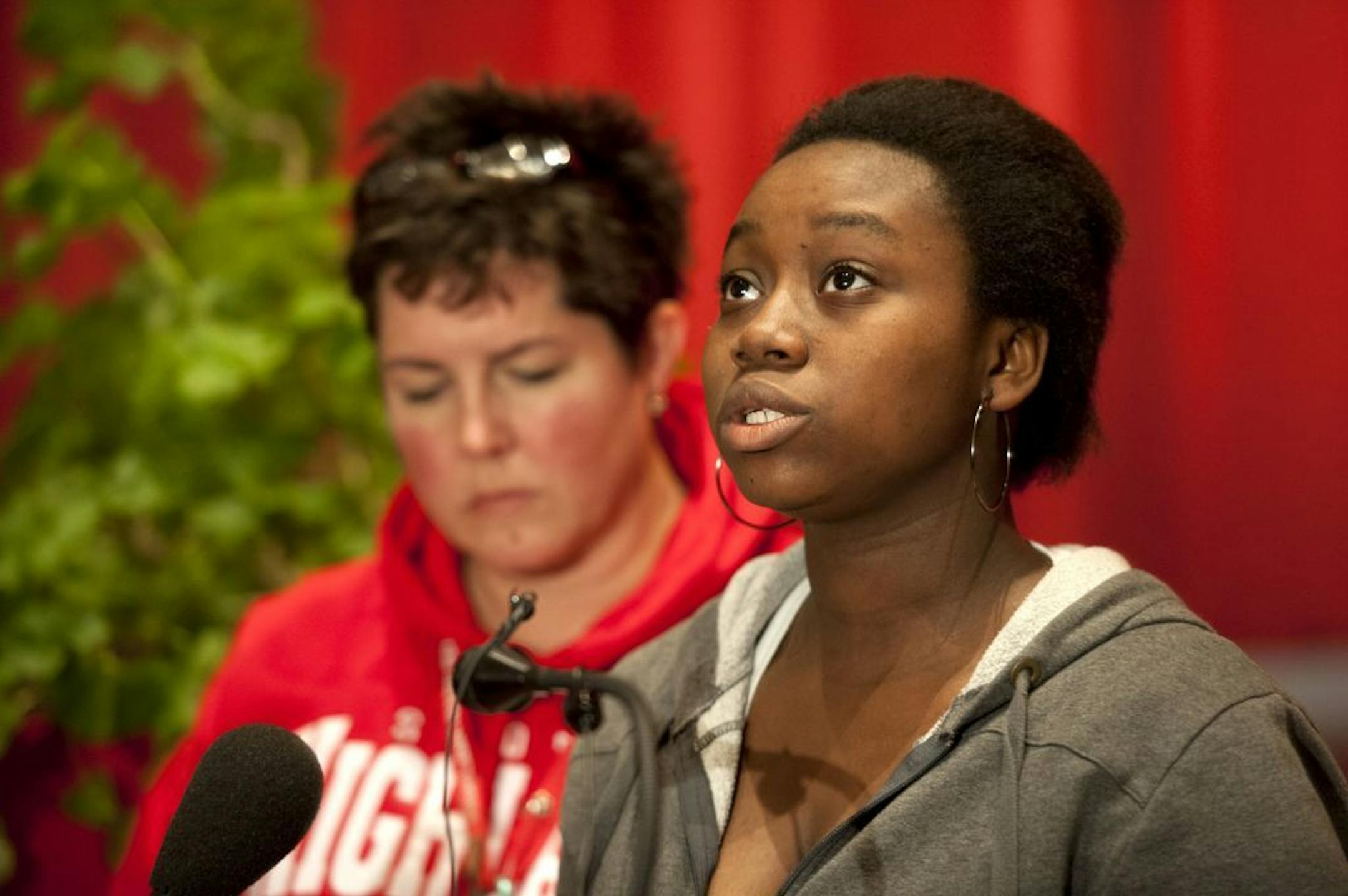 Highland Park Senior High School junior Adetutu Adebowale spoke to the media about her friend Medard Prosper who was killed in a car accident Thursday night. Behind her on left is school counselor Andrea Dickinson.