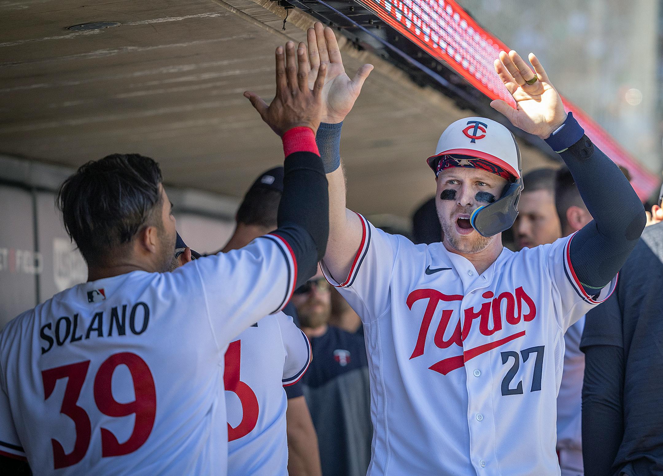 Minnesota Twins catcher Ryan Jeffers (27) celebrates a run during the top of the eighth inning.